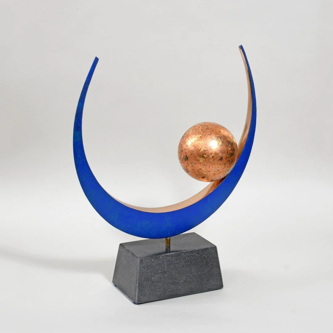   Era IV  
 £2,750
 Philip Hearsey
 Bronze Ring and Sphere finished with
 Pulverised Metal Leaf on Glass Slate
Composite Base
 Sculpture Size: 39cm x 32cm x 10cm