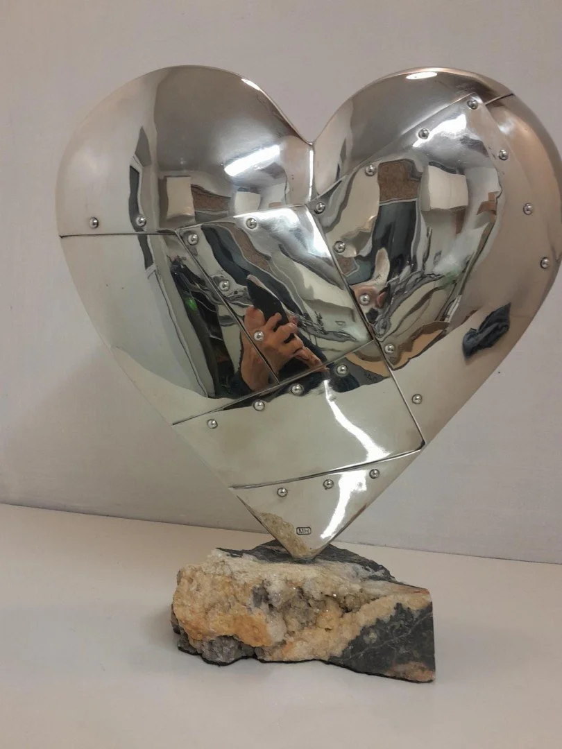   Resilient Heart  
 £1,590
 OrigMal
 Stainless Steel on a Rock Specimen
 Sculpture Size: 33cm x 30cm x 6cm