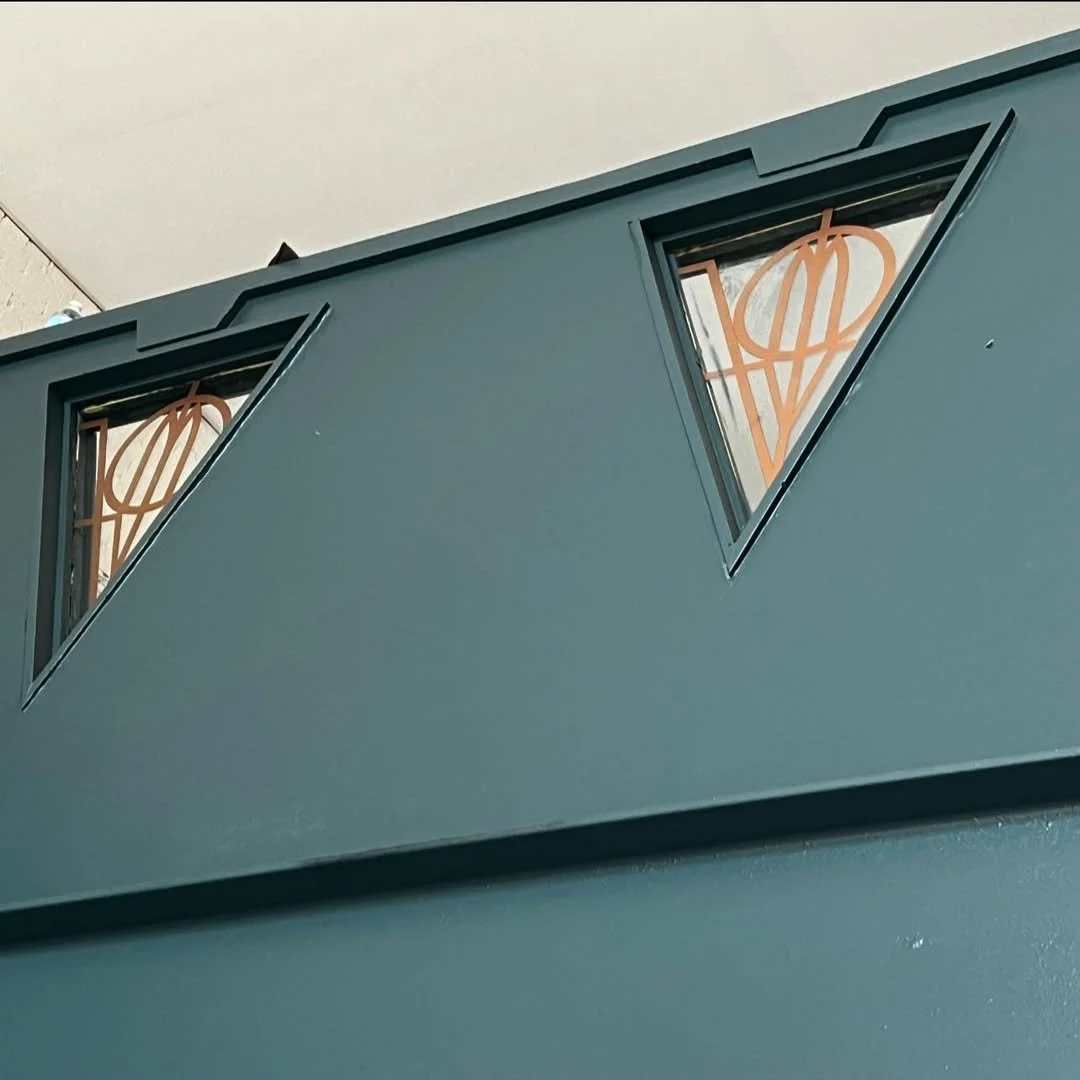 triangle windows in a green balcony