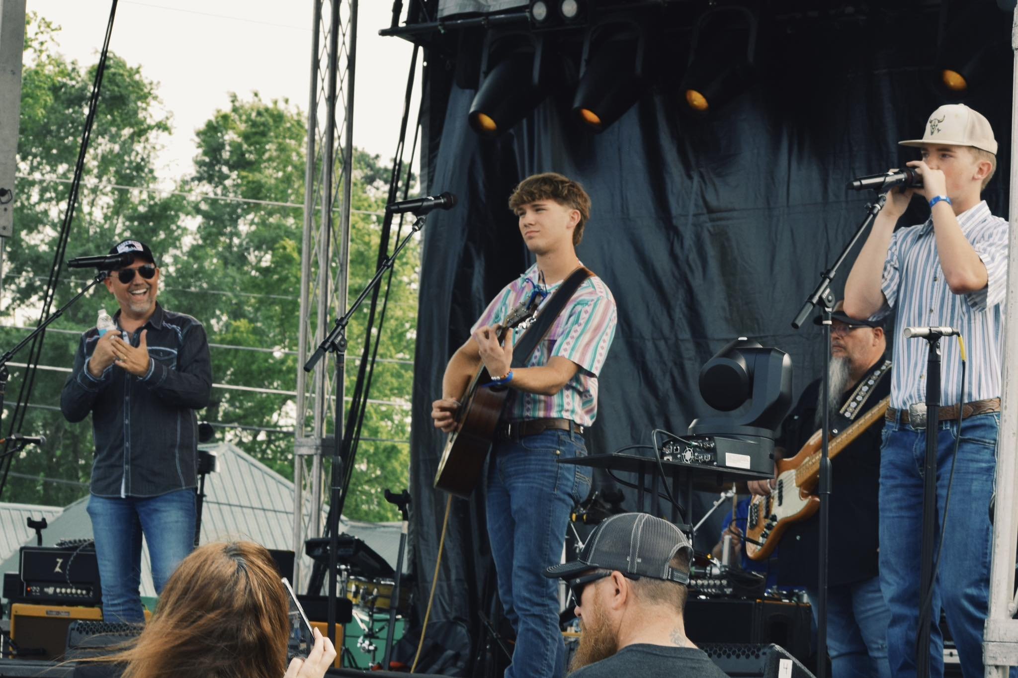 Three singers on a stage