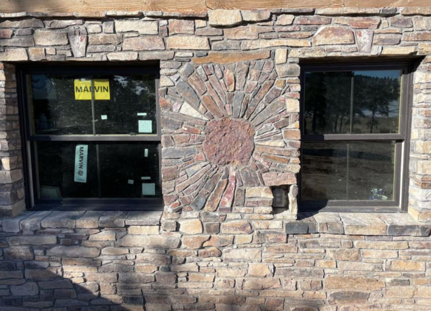 hand-gathered slate wainscot with decorative sunburst. my father built the rest of the home