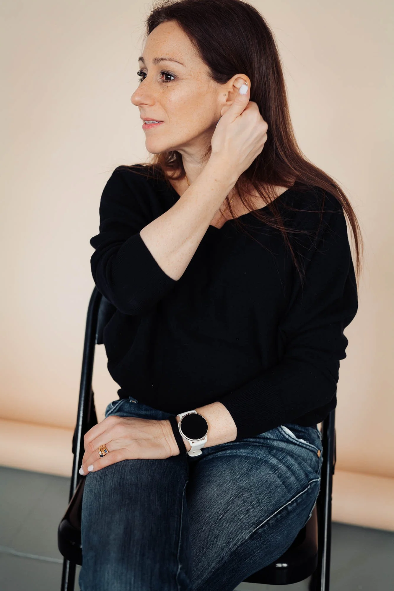 Psychologist Dr Anna sat on chair