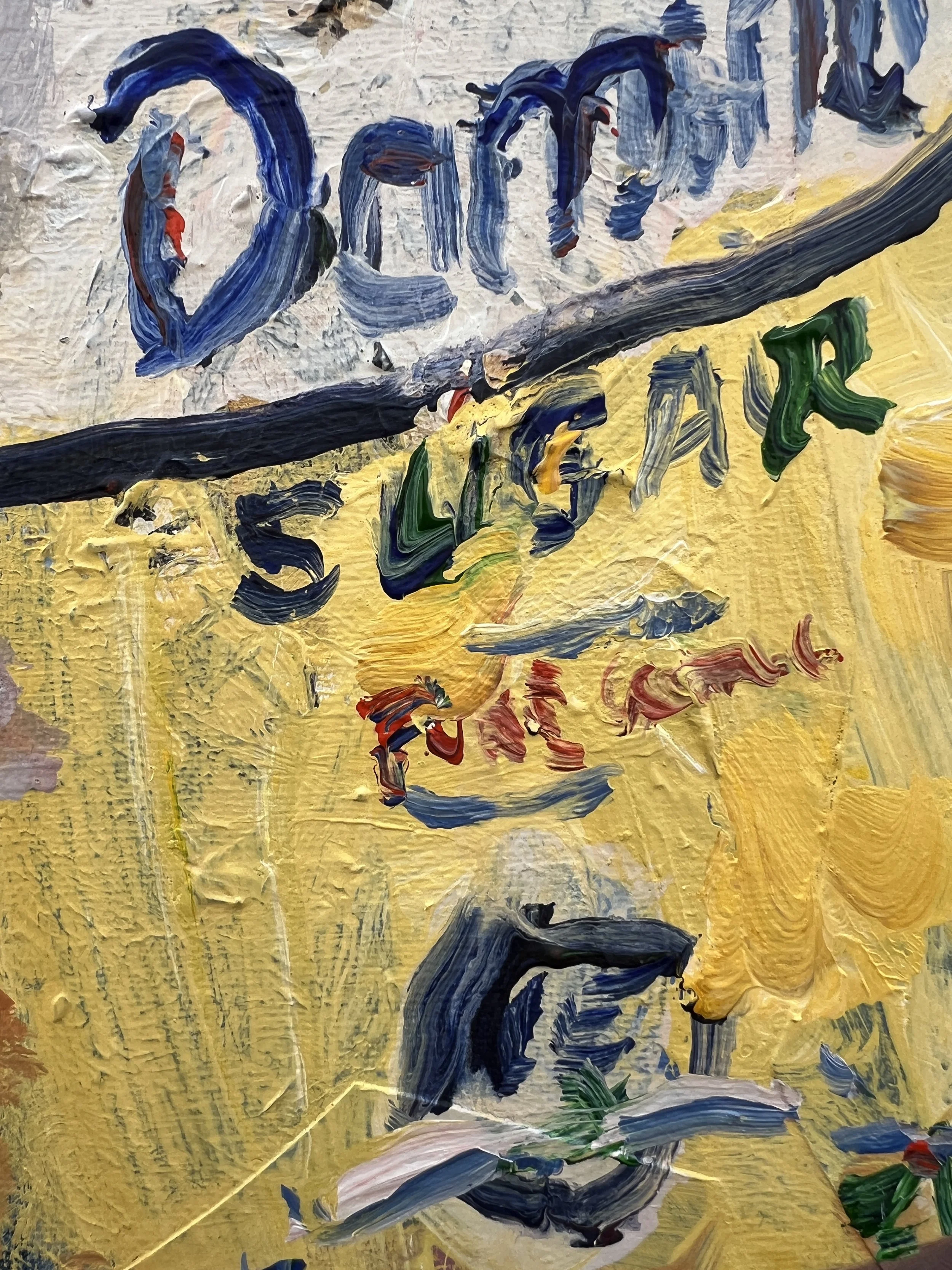 Brushwork detail of Loose expressive Domino sugar yellow bag with blue script lettering