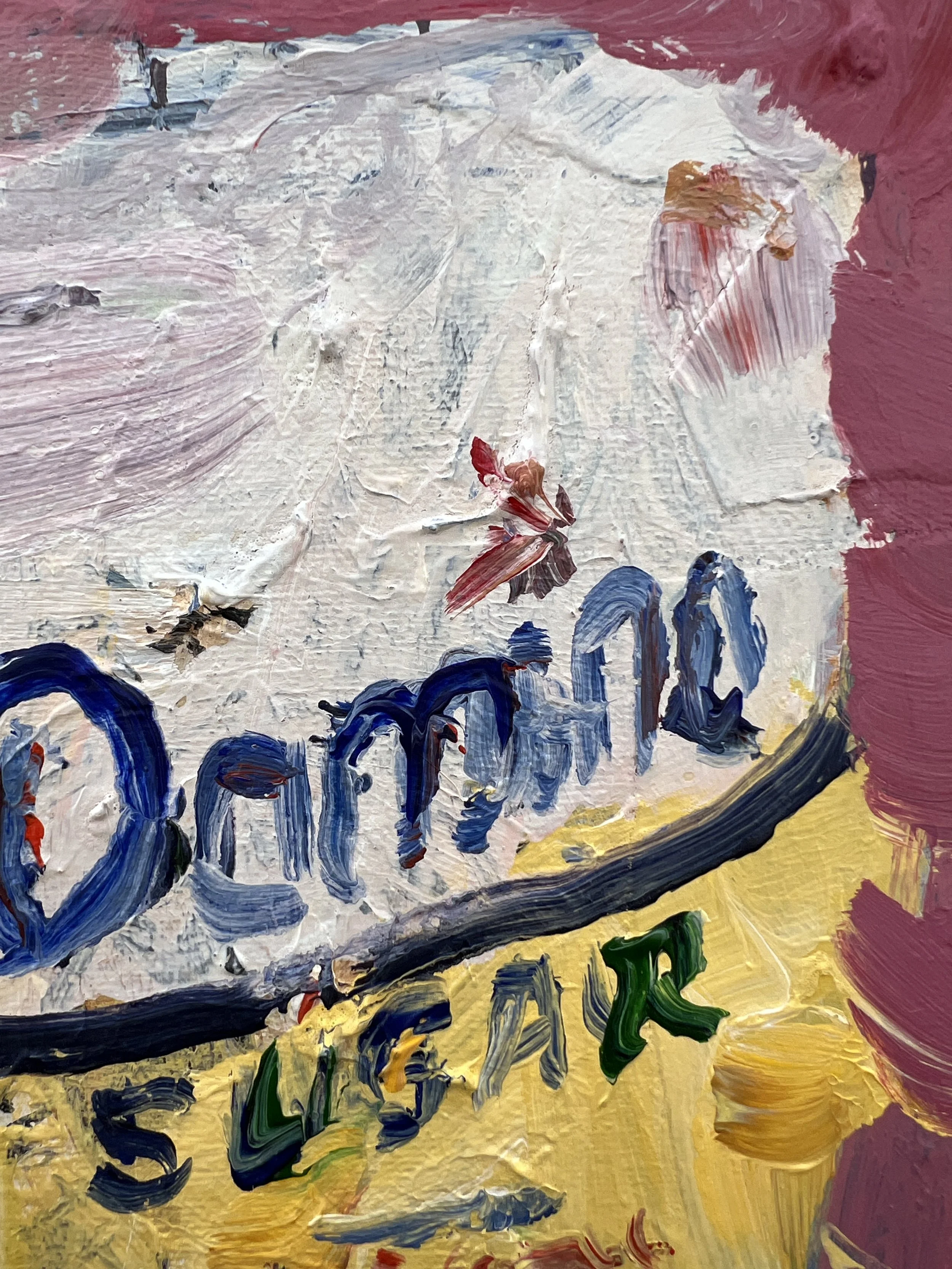 Close-up of Loose Domino sugar yellow bag with blue script lettering