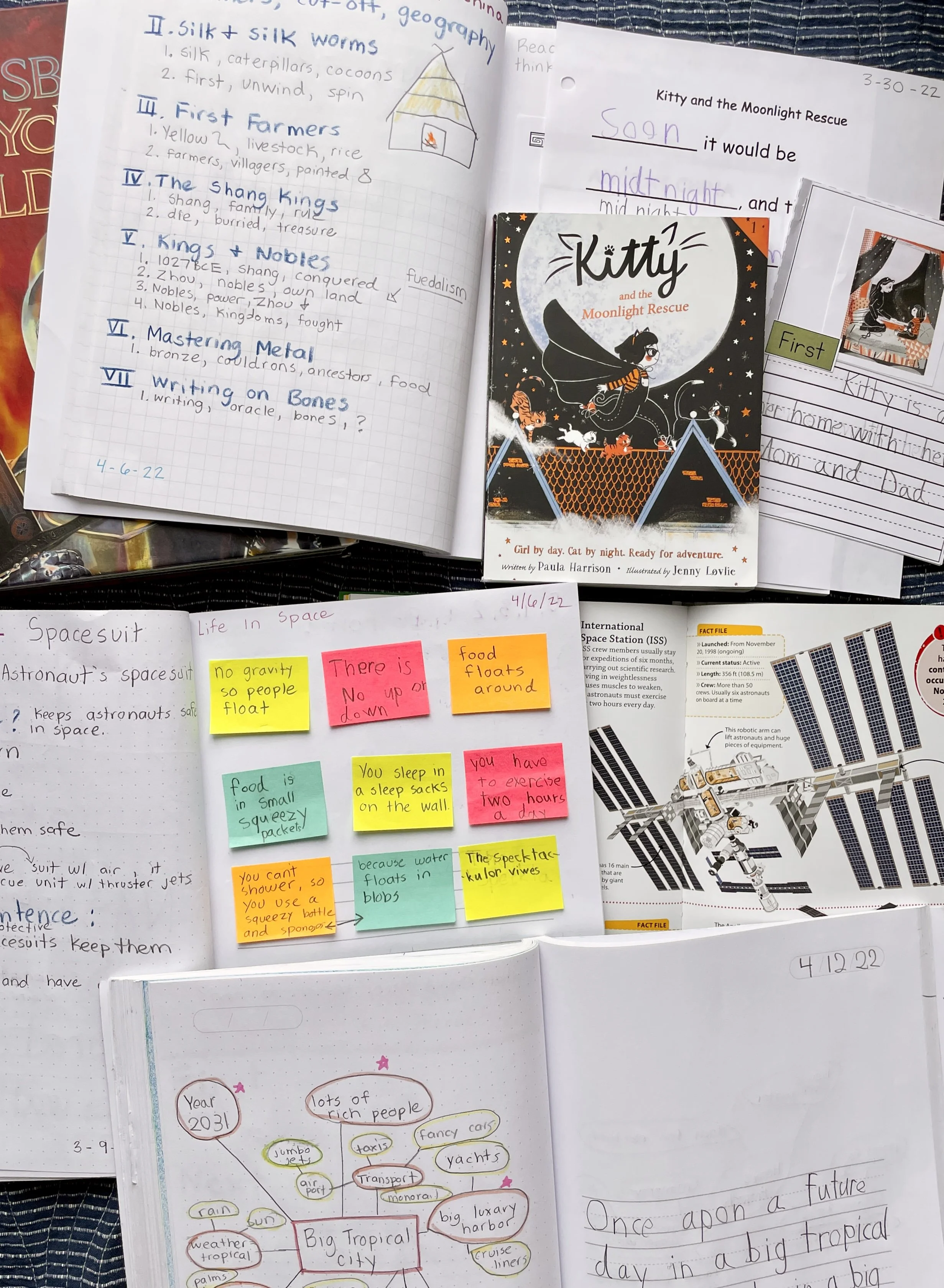 Flat lay display of student writing samples.