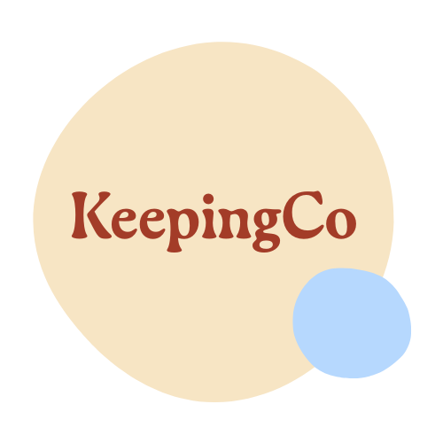Logo with the text 'KeepingCo' inside a large beige circle, with a smaller blue circle overlapping the bottom right of the beige circle against a black background.