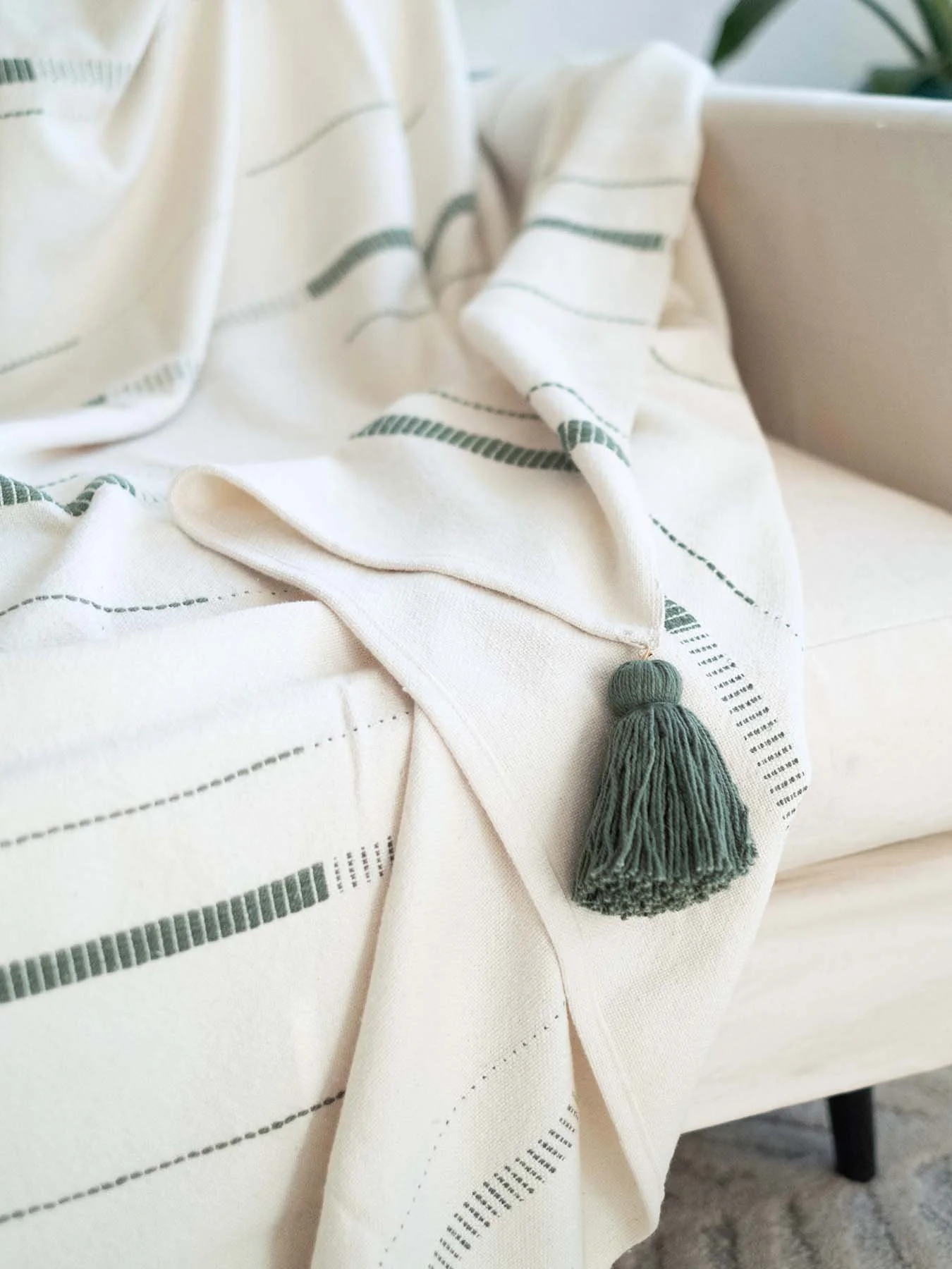 an image of the hallow throw draped over a couch