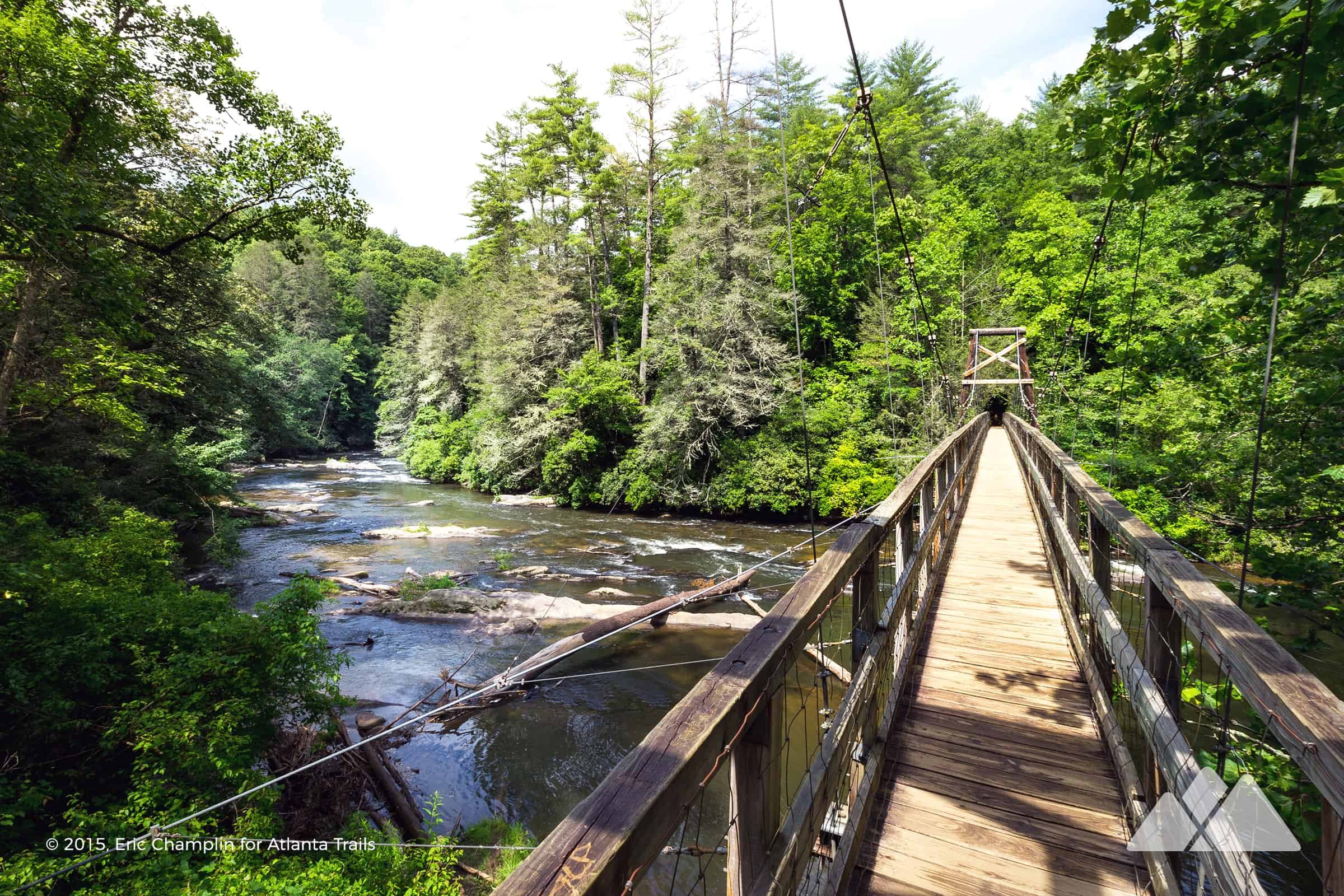 The river flowing under the toccoa river swinging bridge in blue ridge, ga