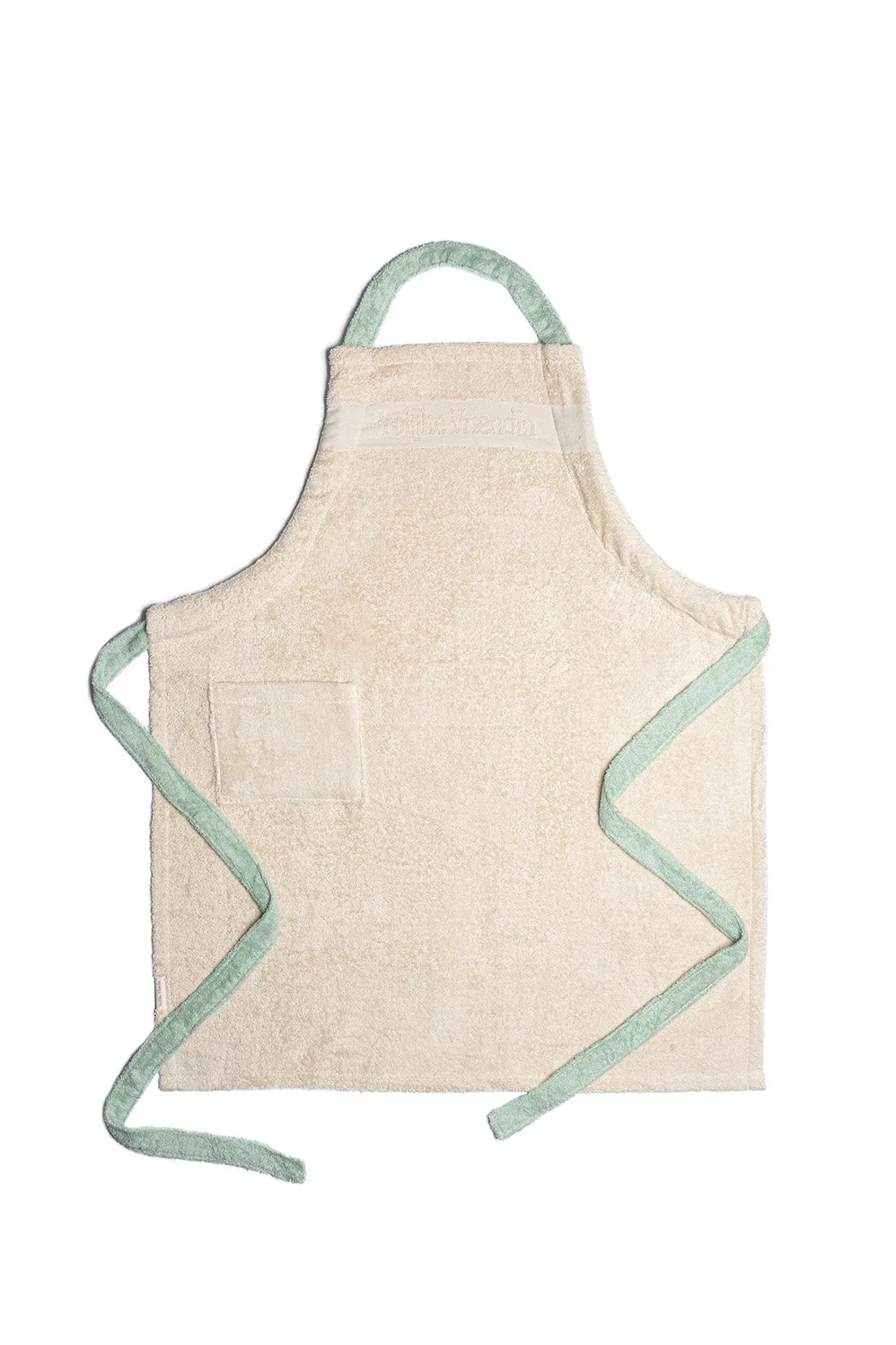 Beige schort met groene bies en voorvakje – productfotografie keukenaccessoires