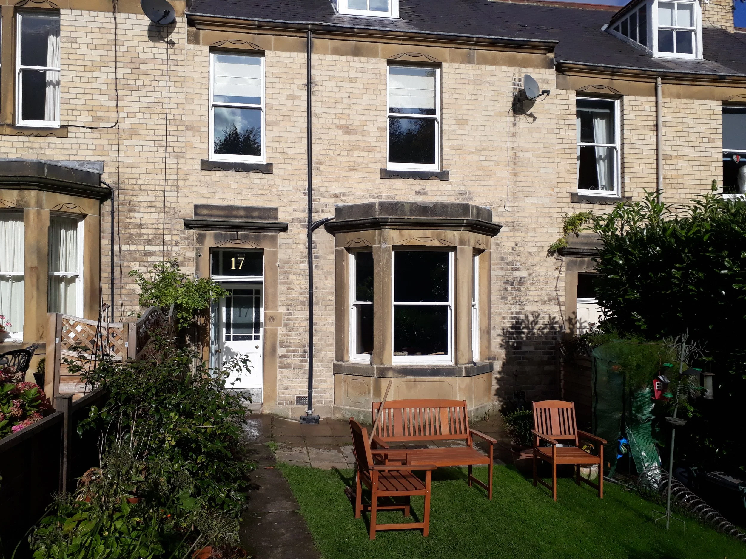 A lovely pale brick historical terraced house with a bay window, repointed in Hexham, Northumberland.
