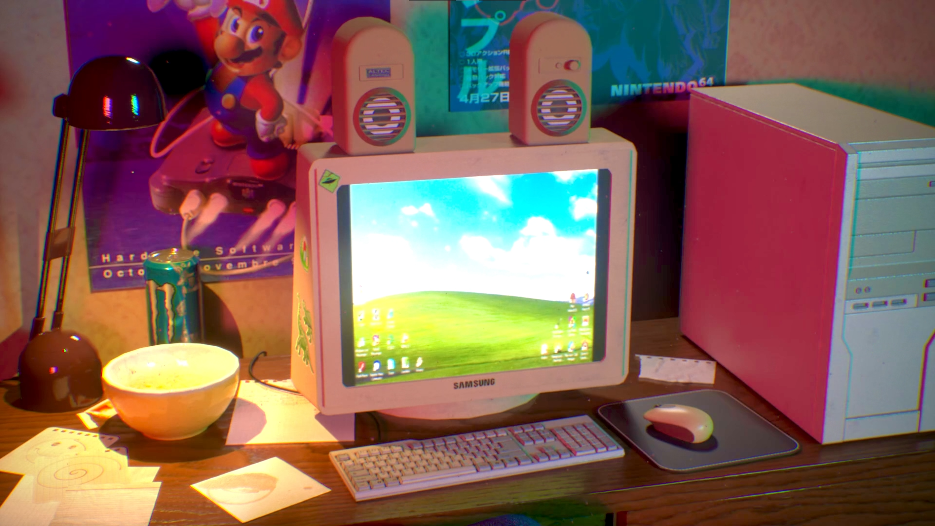 Un bureau avec un ordinateur, un clavier, une souris, une lampe, un moniteur, un bol, des papiers et une canette de Monster bleue. En arrière-plan, une affiche de Mario et poster Zelda.