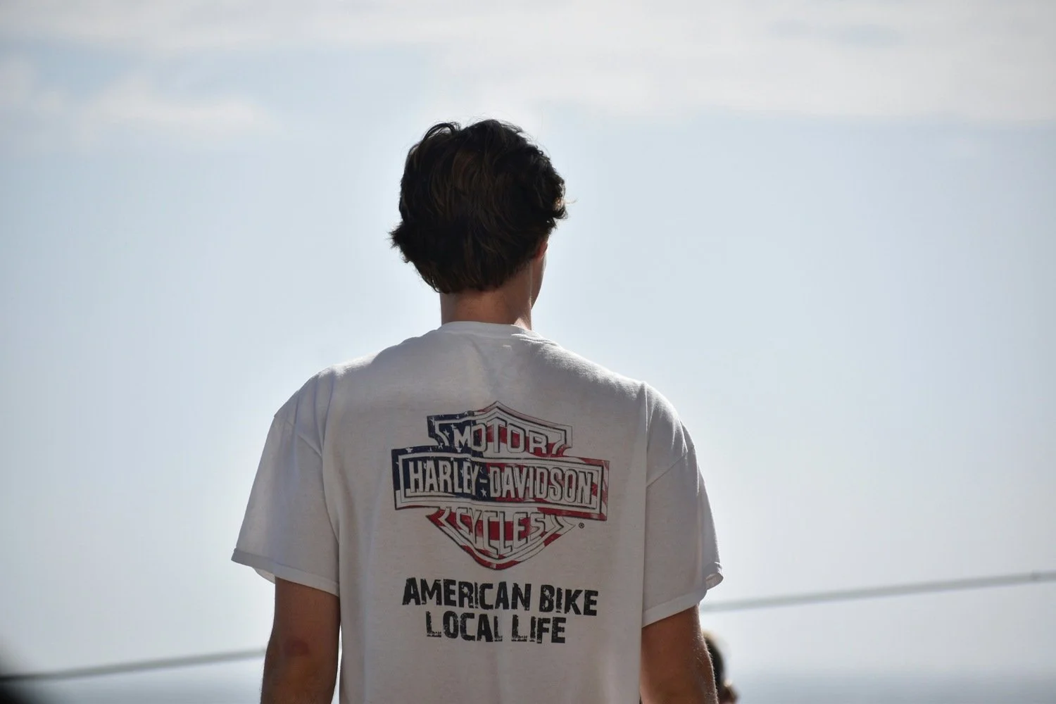 ADHD young adult male wearing white t-shirt