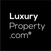 Luxury Property.com logo with white text on a black background