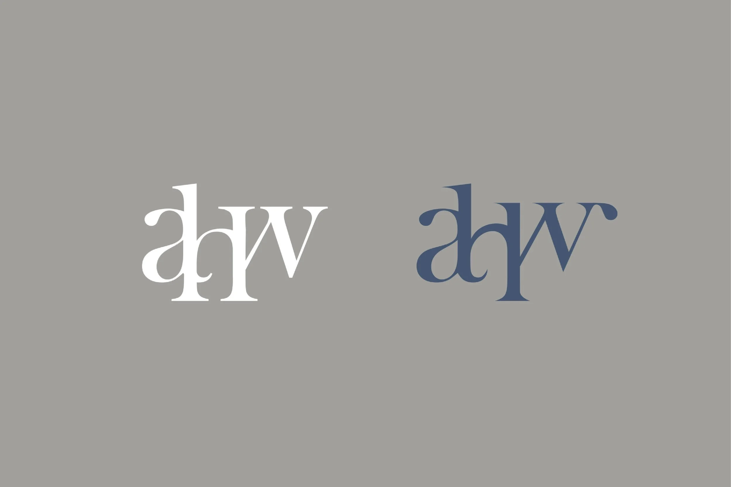 Text in the image shows the letter 'W' flipped horizontally and vertically, with the different orientations displayed on a gray background.