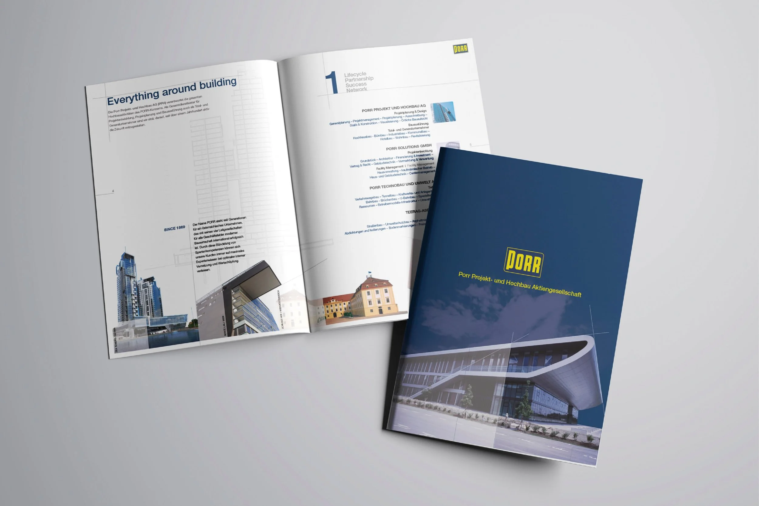 Open brochure displaying images of modern buildings and architectural designs for PORR, a construction firm, with the cover featuring a large architectural structure.