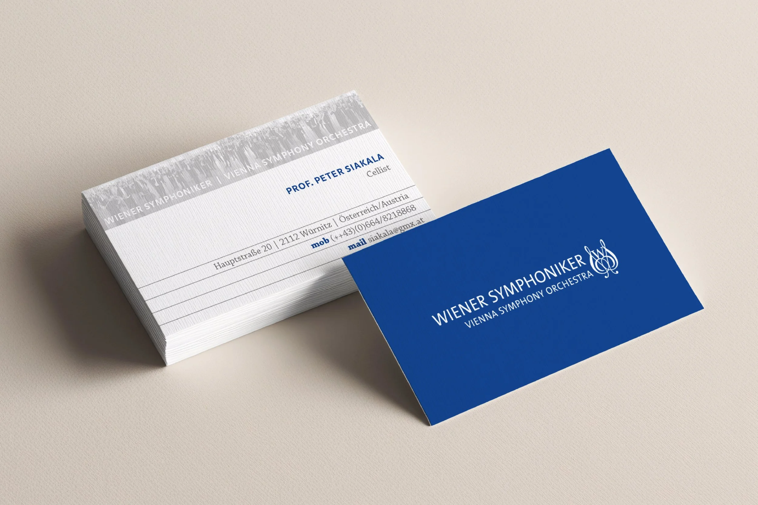 Stack of business cards for the Vienna Symphony Orchestra with a blue card displaying the orchestra's name and logo.