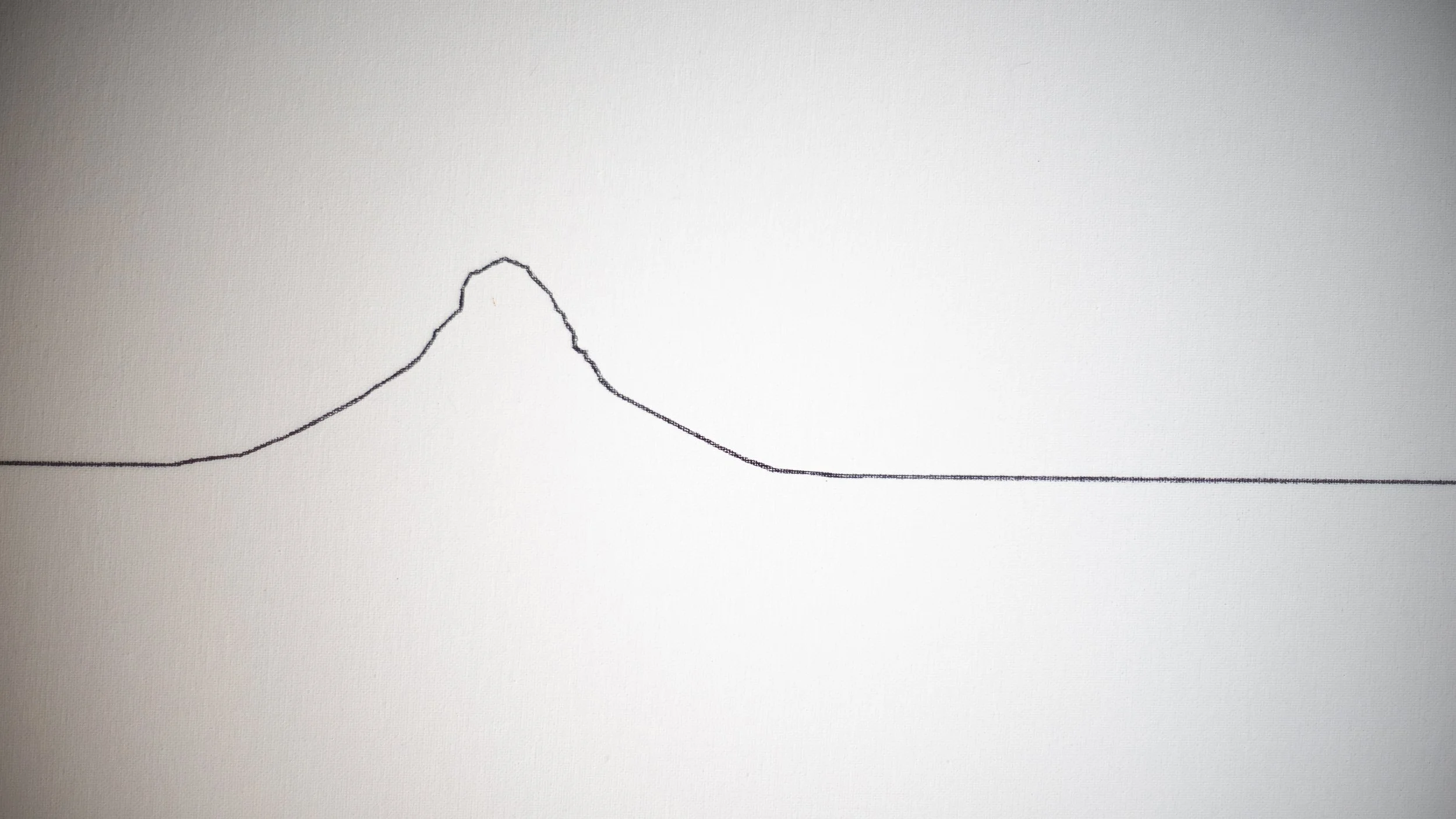 Linienberg of Mount Fuji, reduced to a single hand-drawn black silhouette on a white ground.