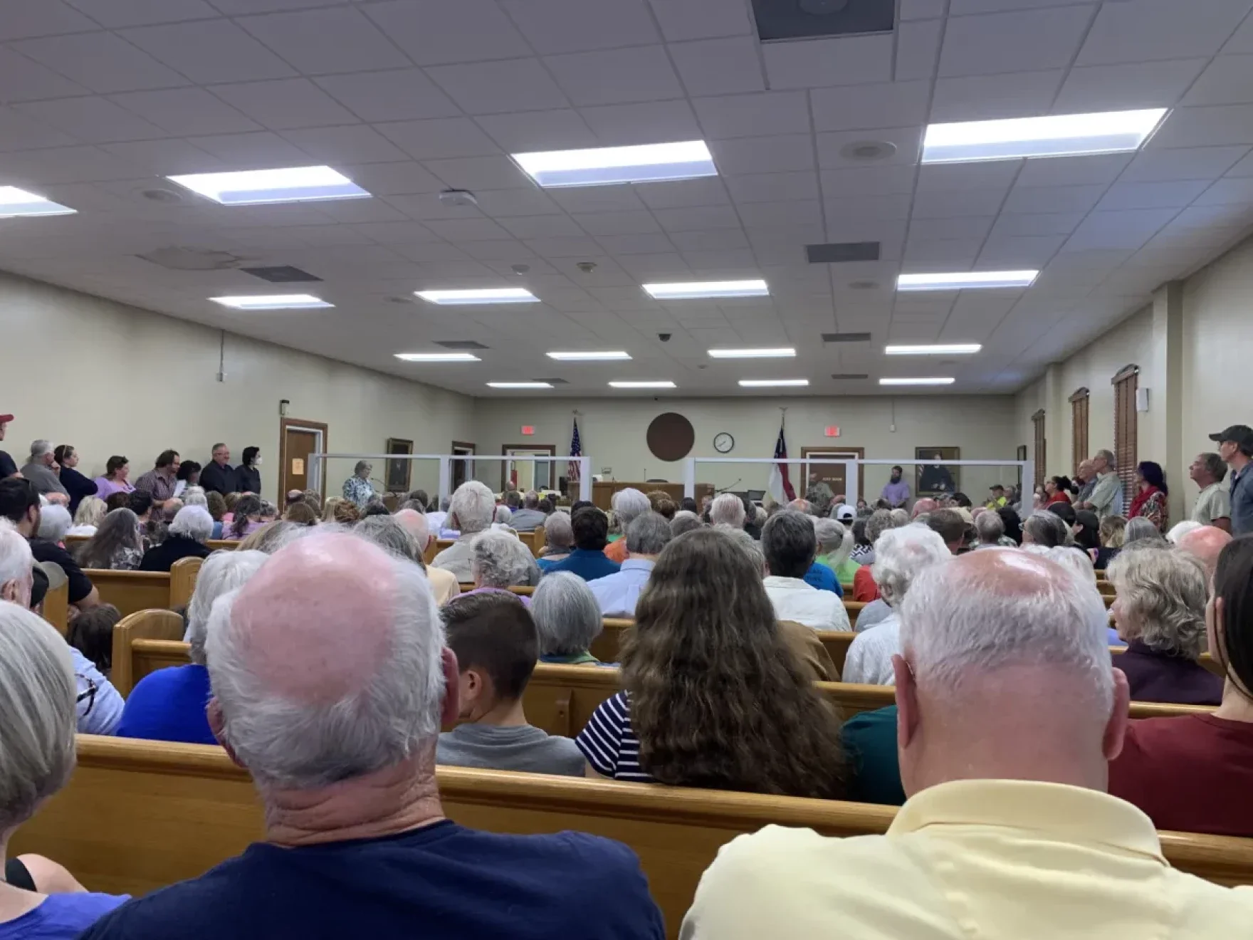 A rural Western North Carolina county will keep its public library in the regional system, but not without debate