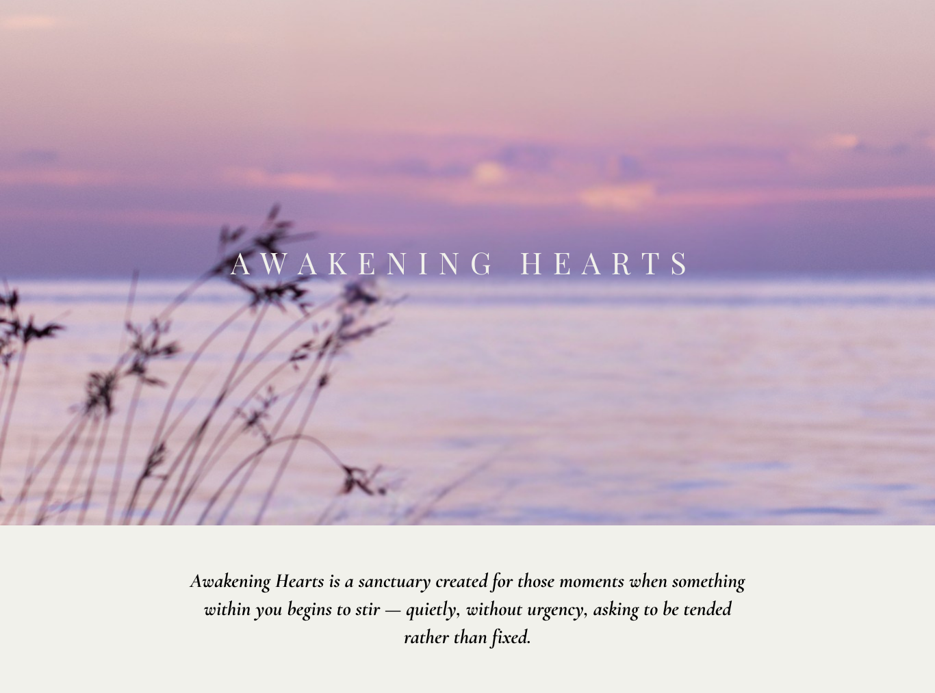 A serene beach scene at dawn with pink and purple skies, silhouettes of plants in the foreground, and gentle waves in the background. Overlaid text reads "AWAKENING HEARTS."