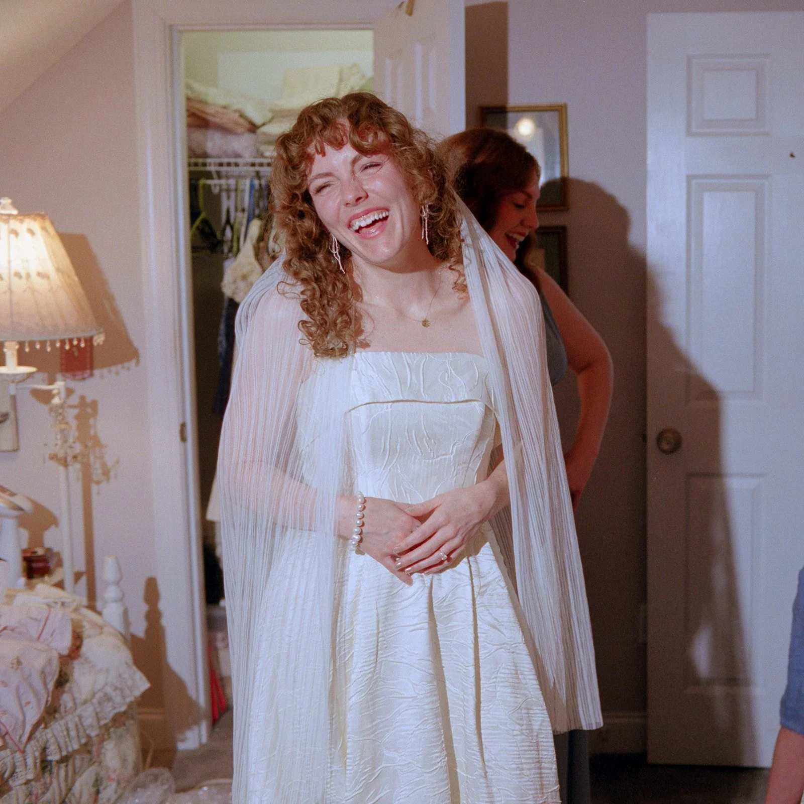 bride laughing in wedding dress on portra 400 film flash