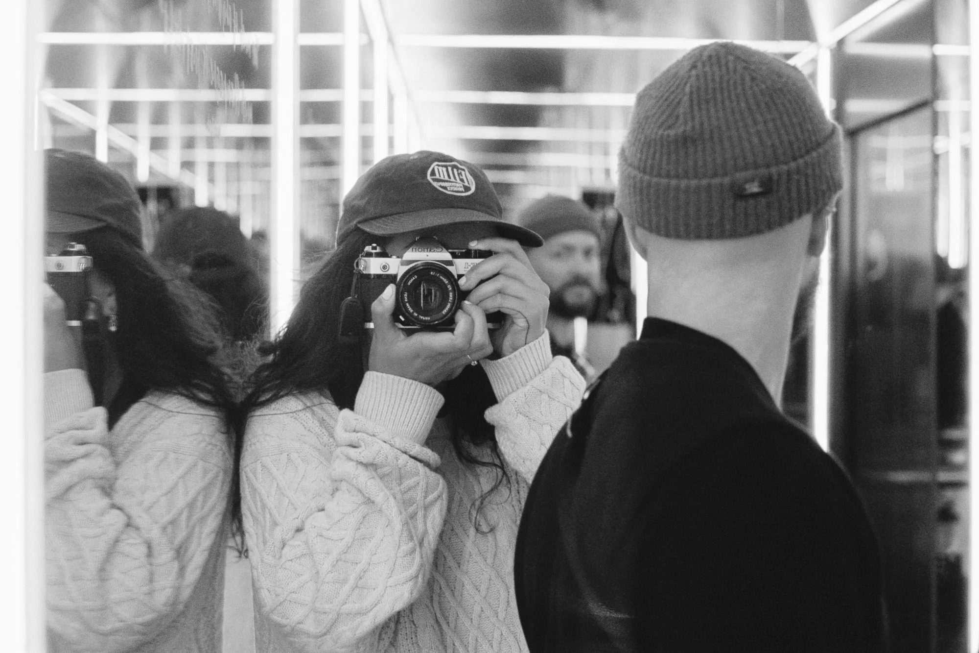 mirror self portrait of film wedding photographer with mirrors and husband