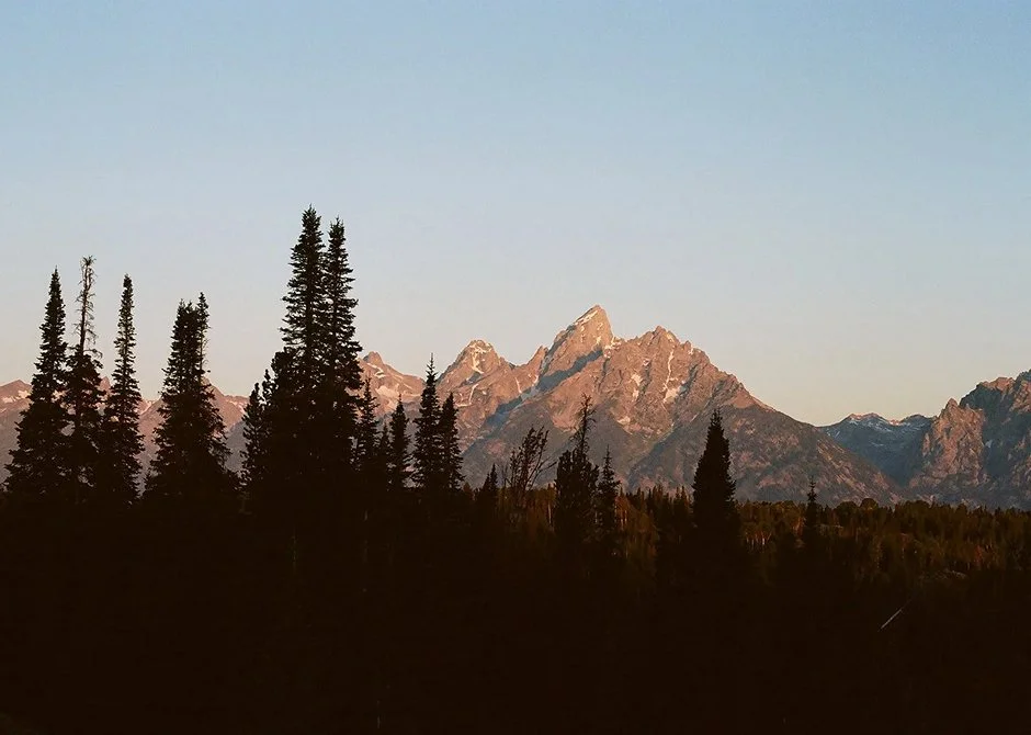 grand tetons mountain range during golden sunrise