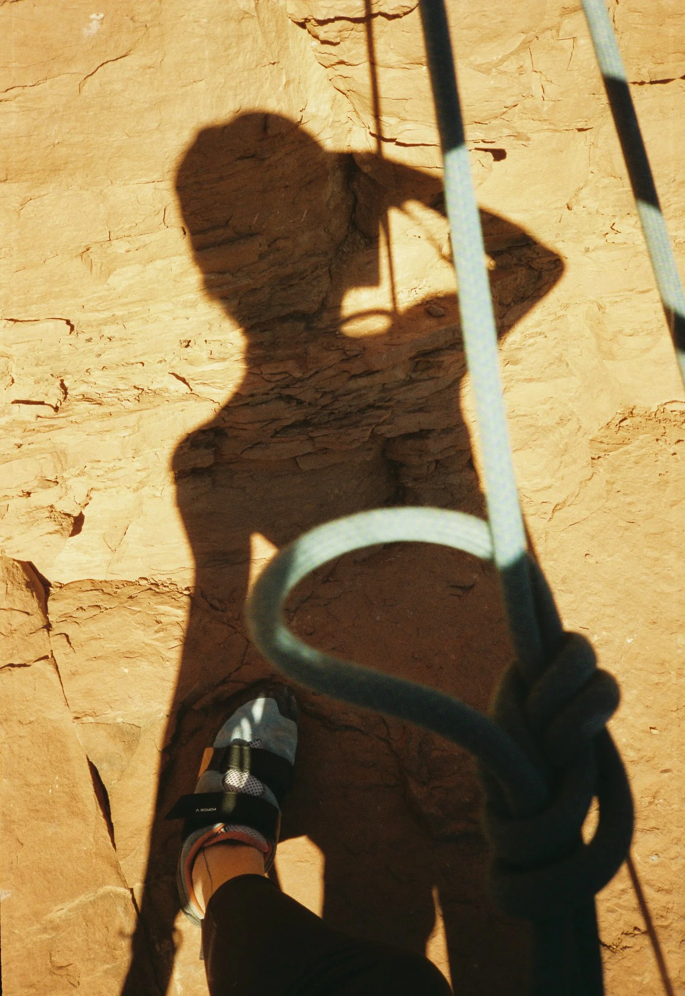 self portrait of photographer rock climbing in desert