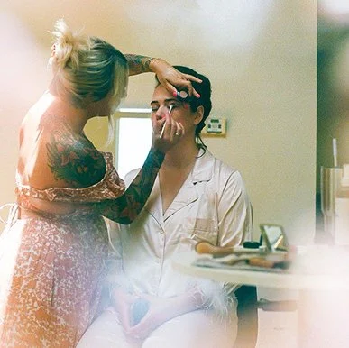 bride getting makeup done with magical hallation