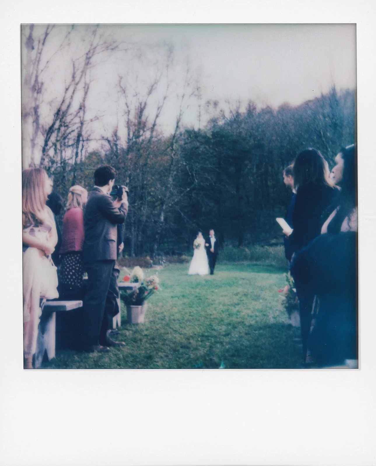 bride walking towards the ceremony in the wide open field at handsome hollow