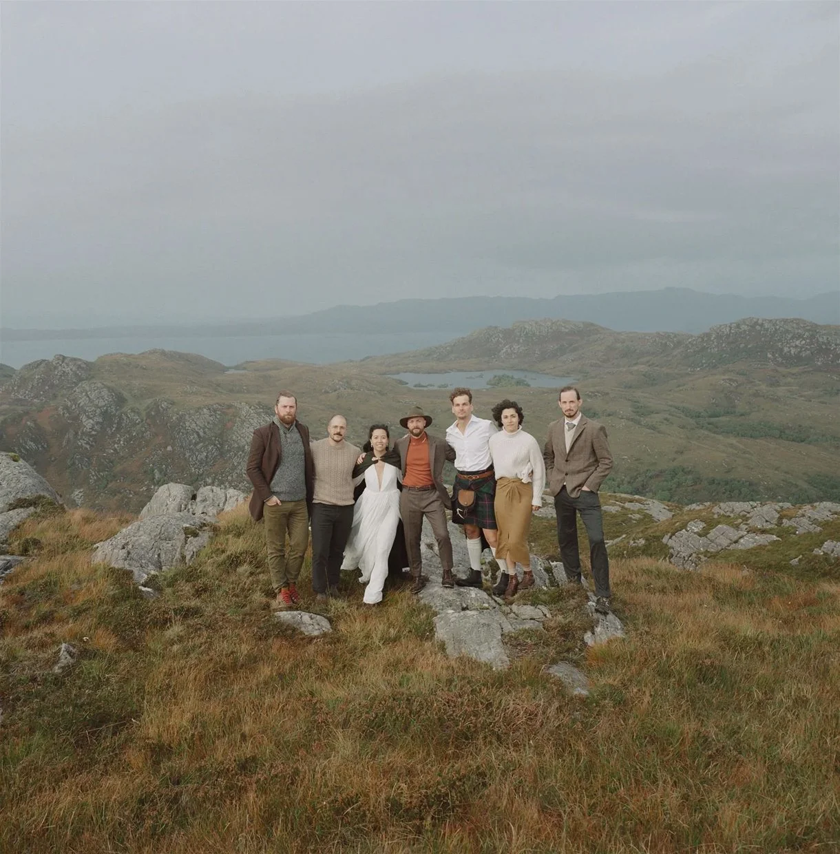 wedding group portrait on scottish mountaintop