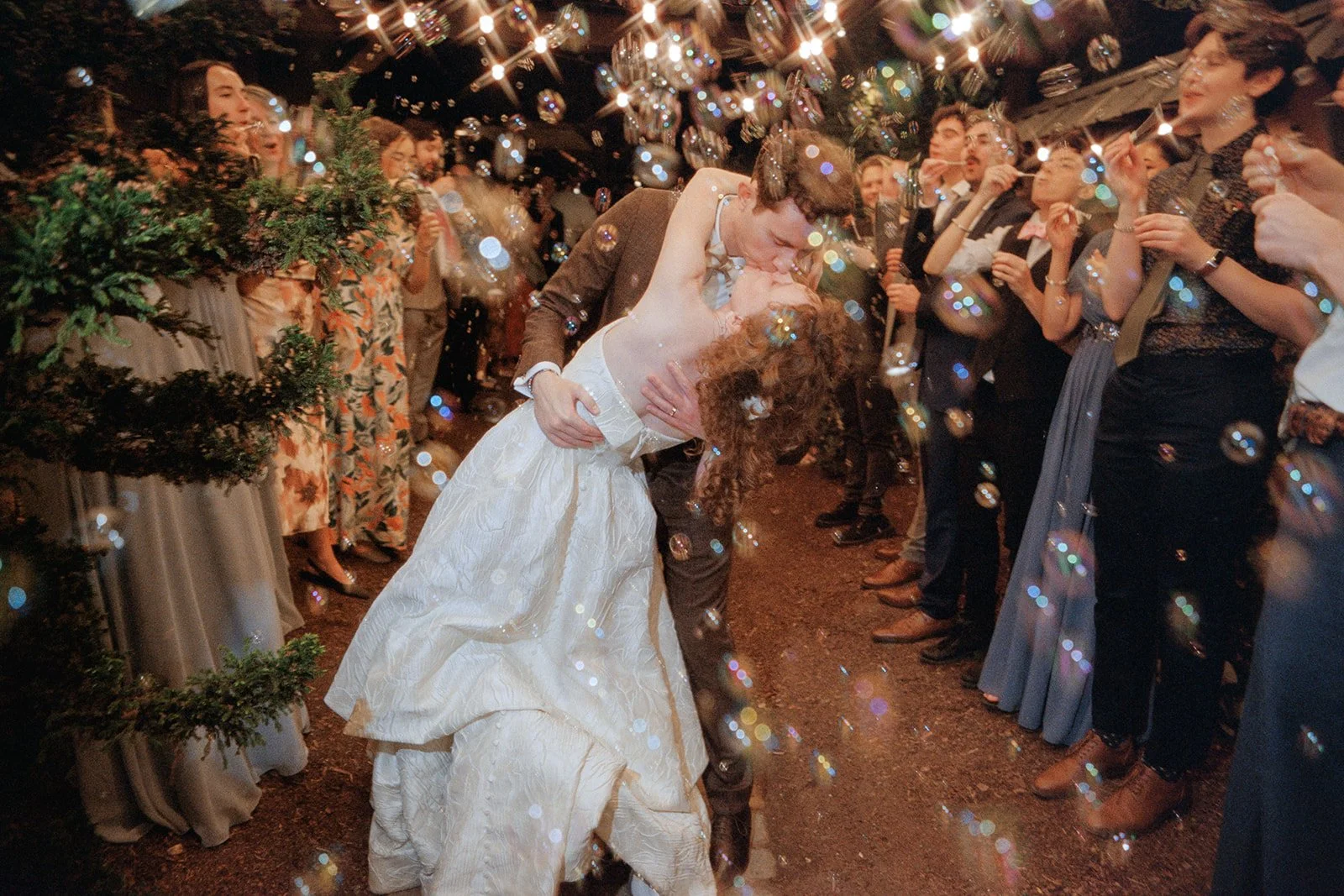bubble reception exit of couple leaving wedding on film