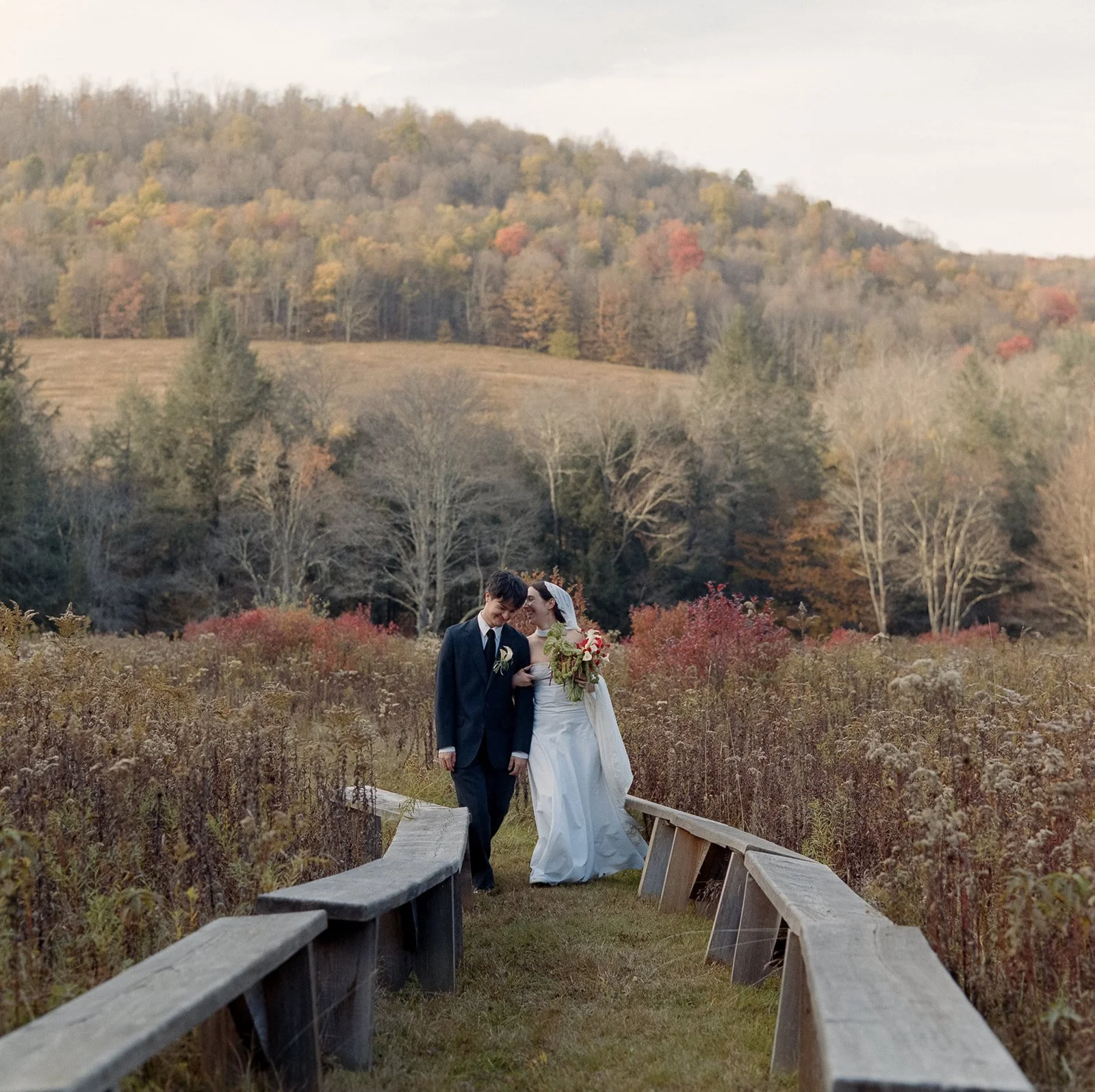 married couple walking the grounds at Handsome Hollow