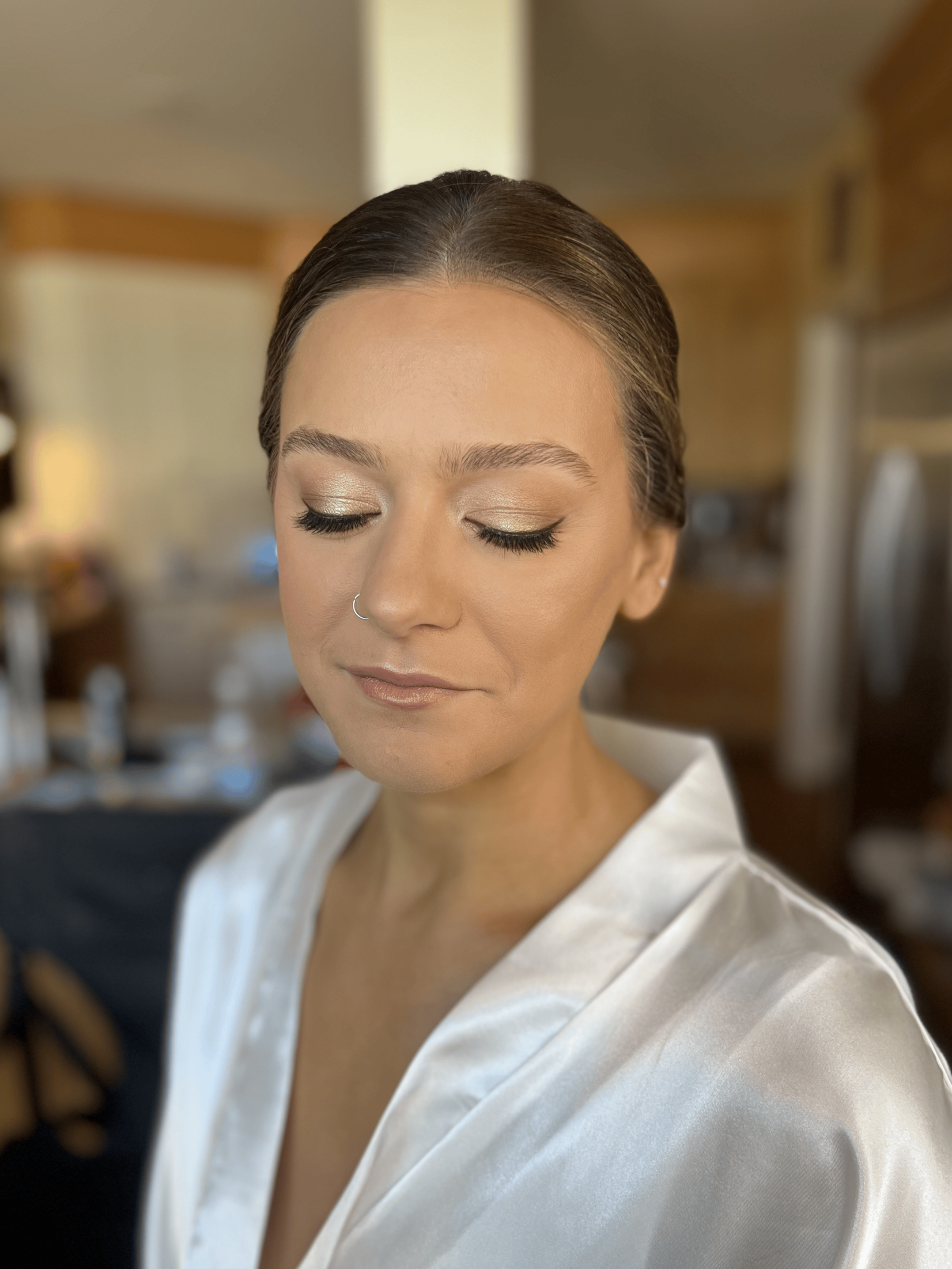 Bride getting her makeup done by Shannon Sharland, a bridal makeup artist in Newport Rhode Island