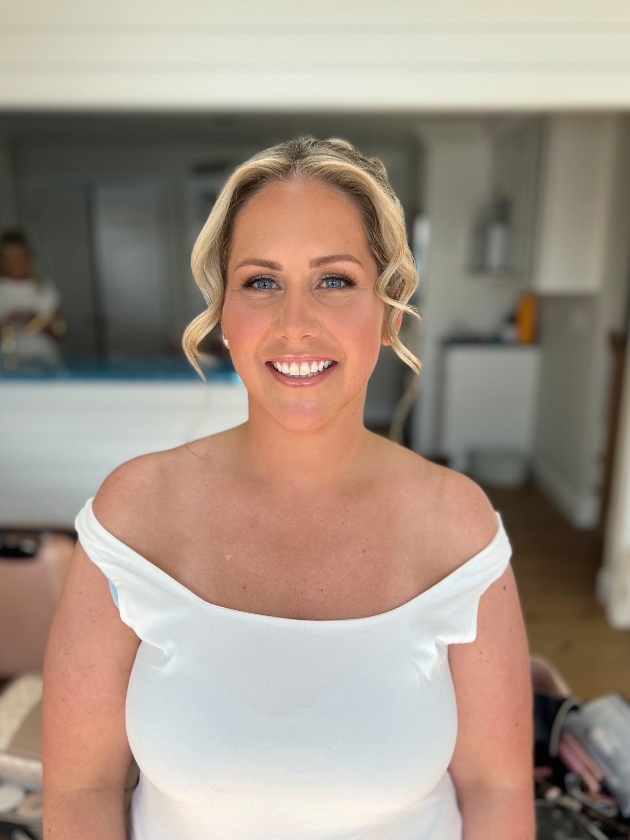 Bride getting her makeup done by Shannon Sharland, a bridal makeup artist in Newport Rhode Island