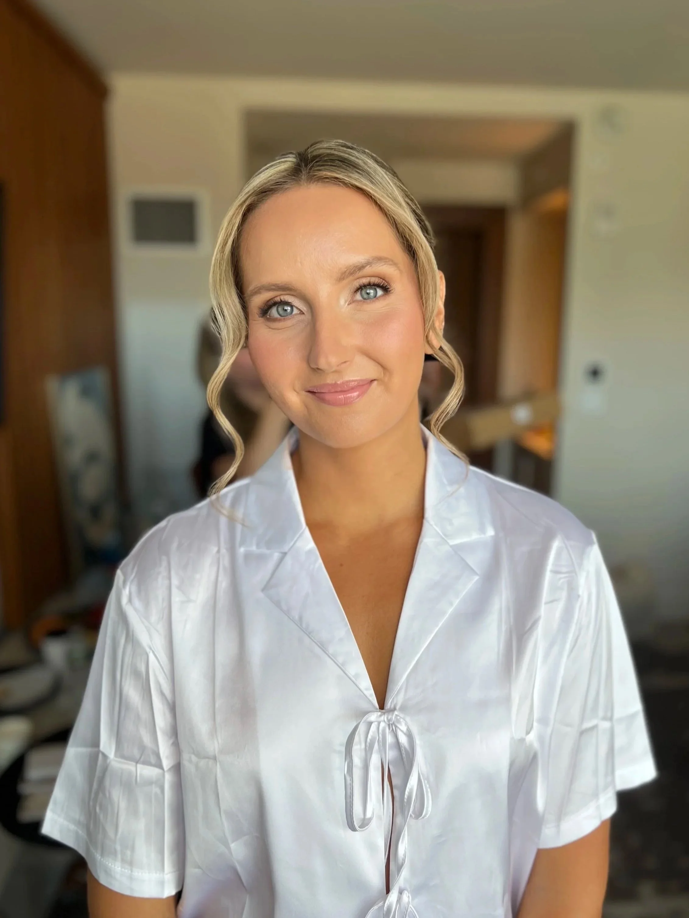 Bride getting her makeup done by Shannon Sharland, a bridal makeup artist in Newport Rhode Island