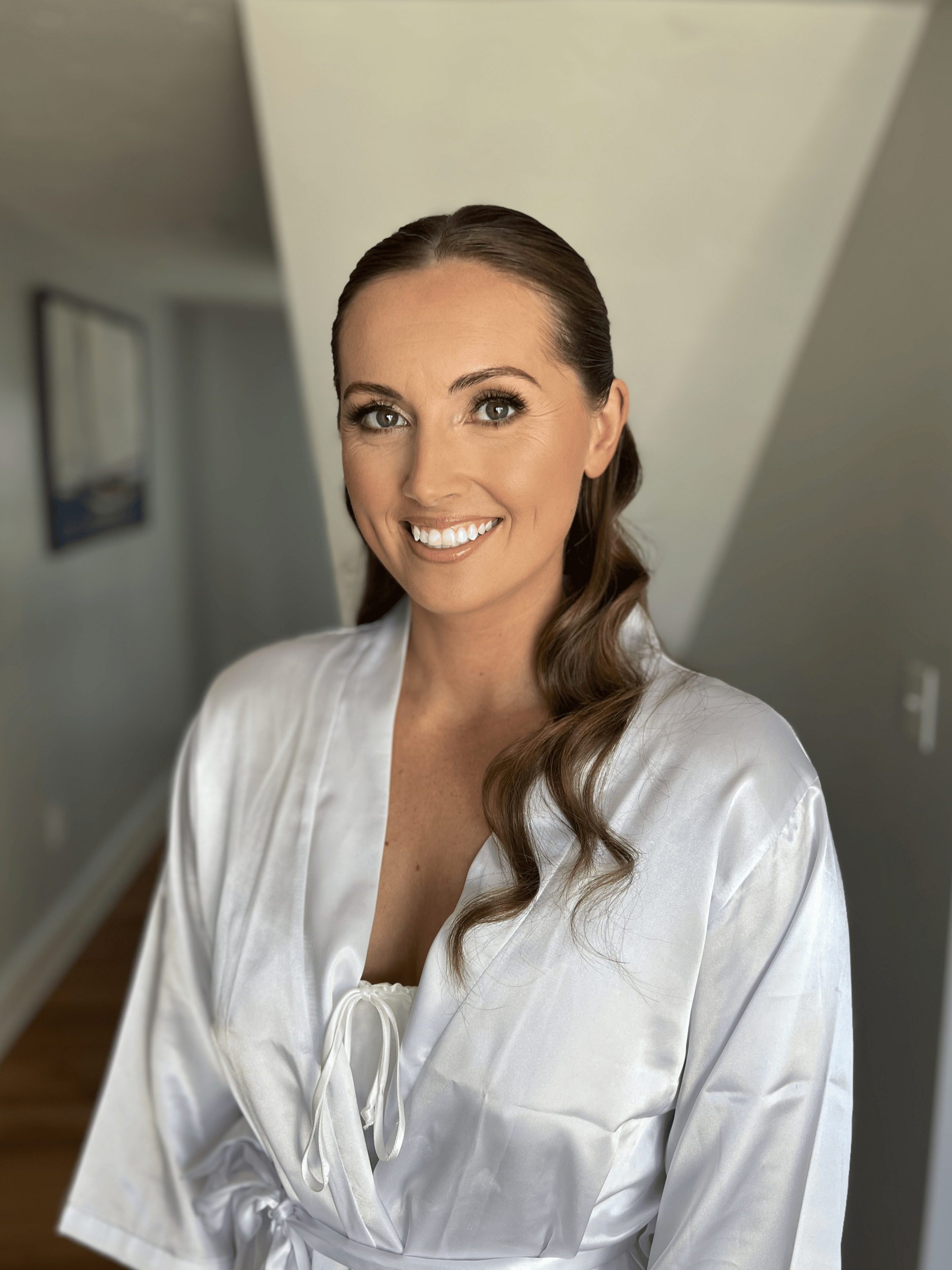 Bride getting her makeup done by Shannon Sharland, a bridal makeup artist in Newport Rhode Island