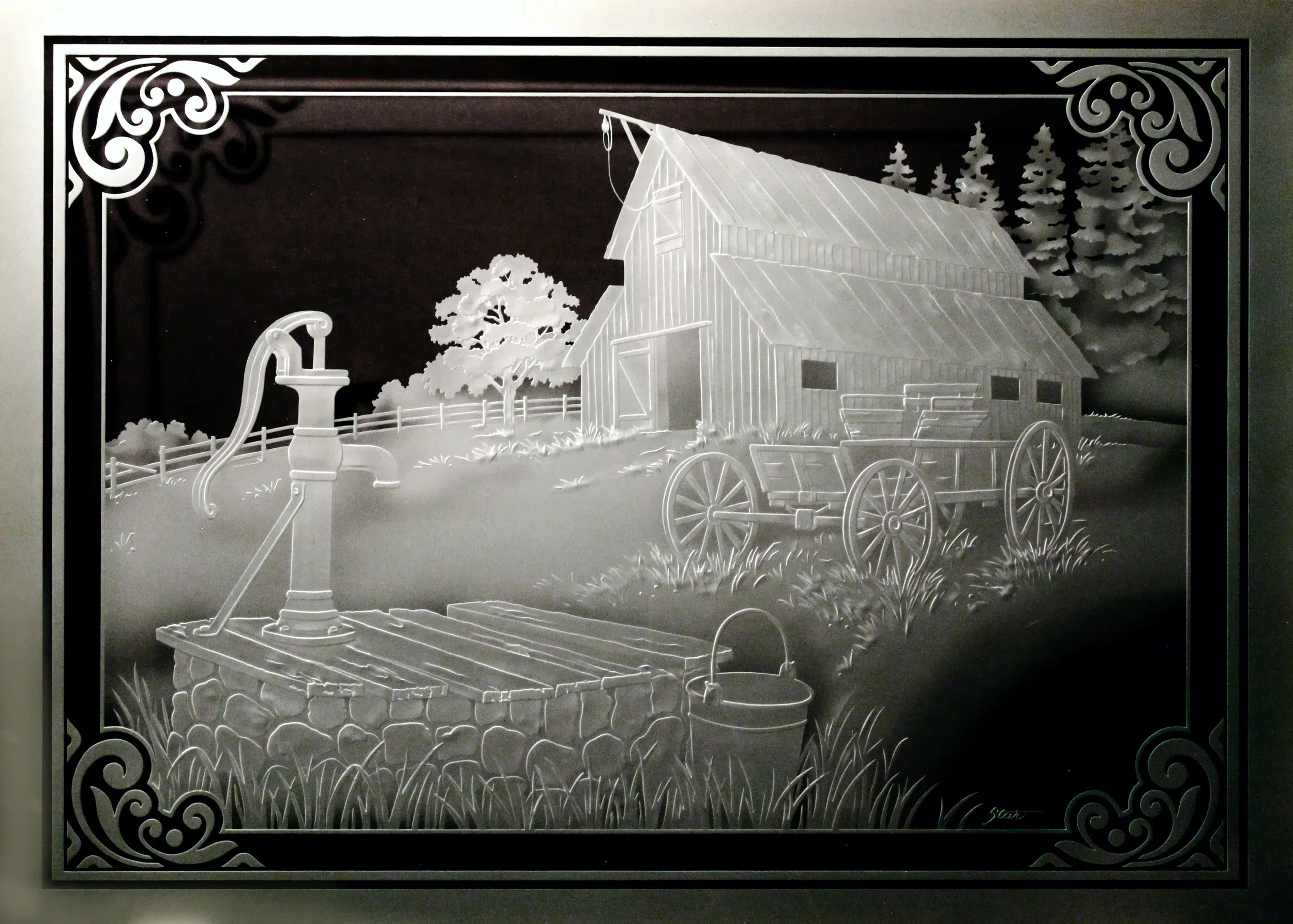 Carved glass art depicting a rustic farm scene with a well, a barn, a horse-drawn wagon, a tree, and pine trees in the background.