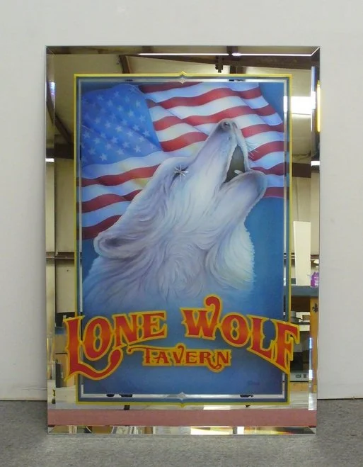 Carved and painted mirror sign for Lone Wolf Tavern with a howling wolf and an American flag in the background.