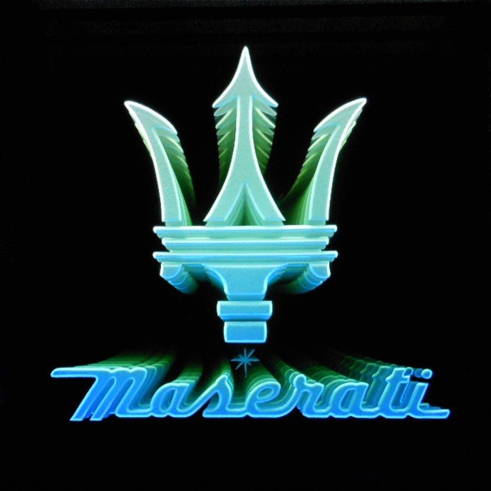 Edge lit glass sign of the Maserati logo with the brand name 'Maserati' in cursive below, and a trident emblem above.