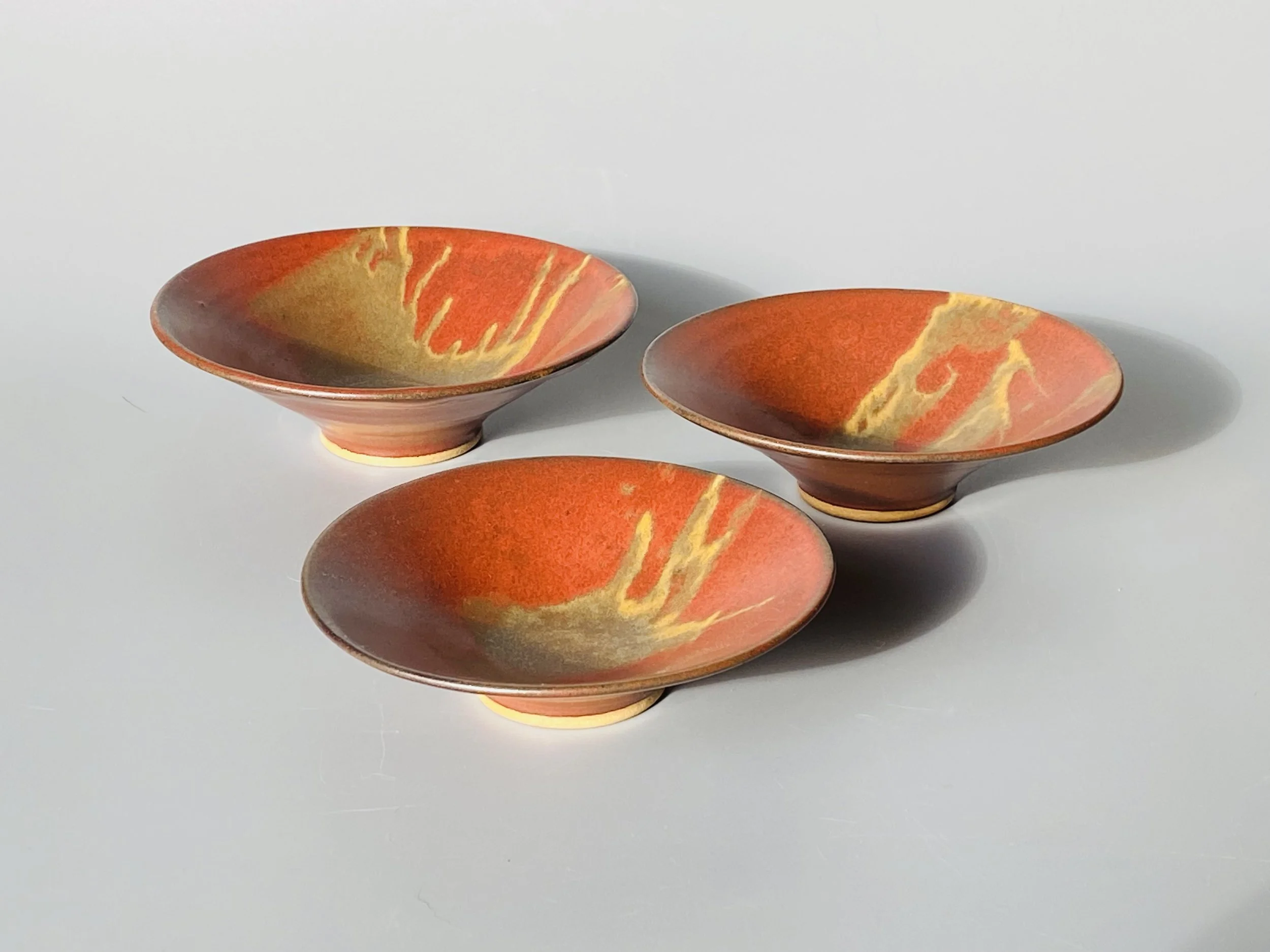 three flared dishes red-ochre.jpeg