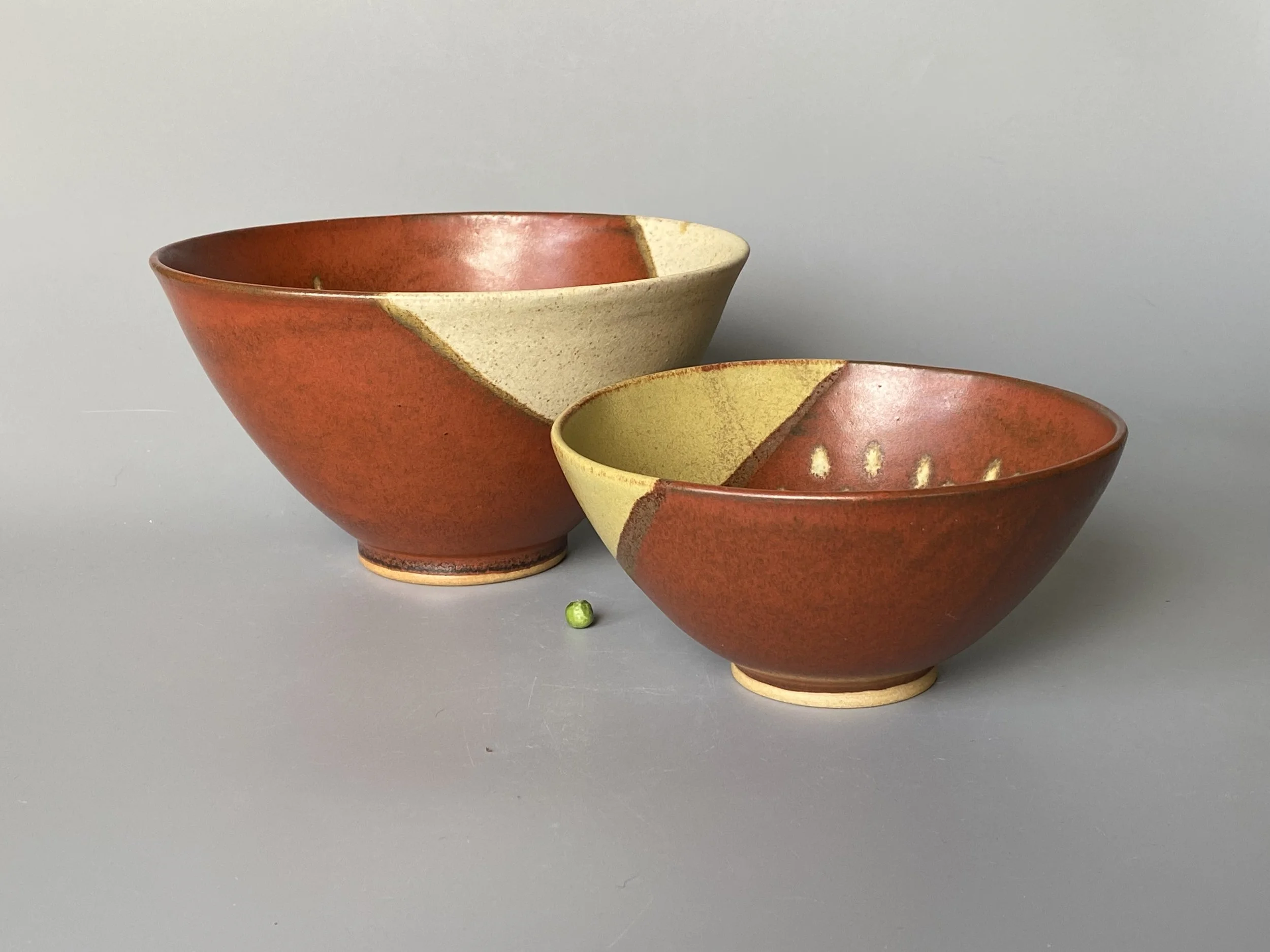 Rust red cream arc small & medium bowls.jpeg