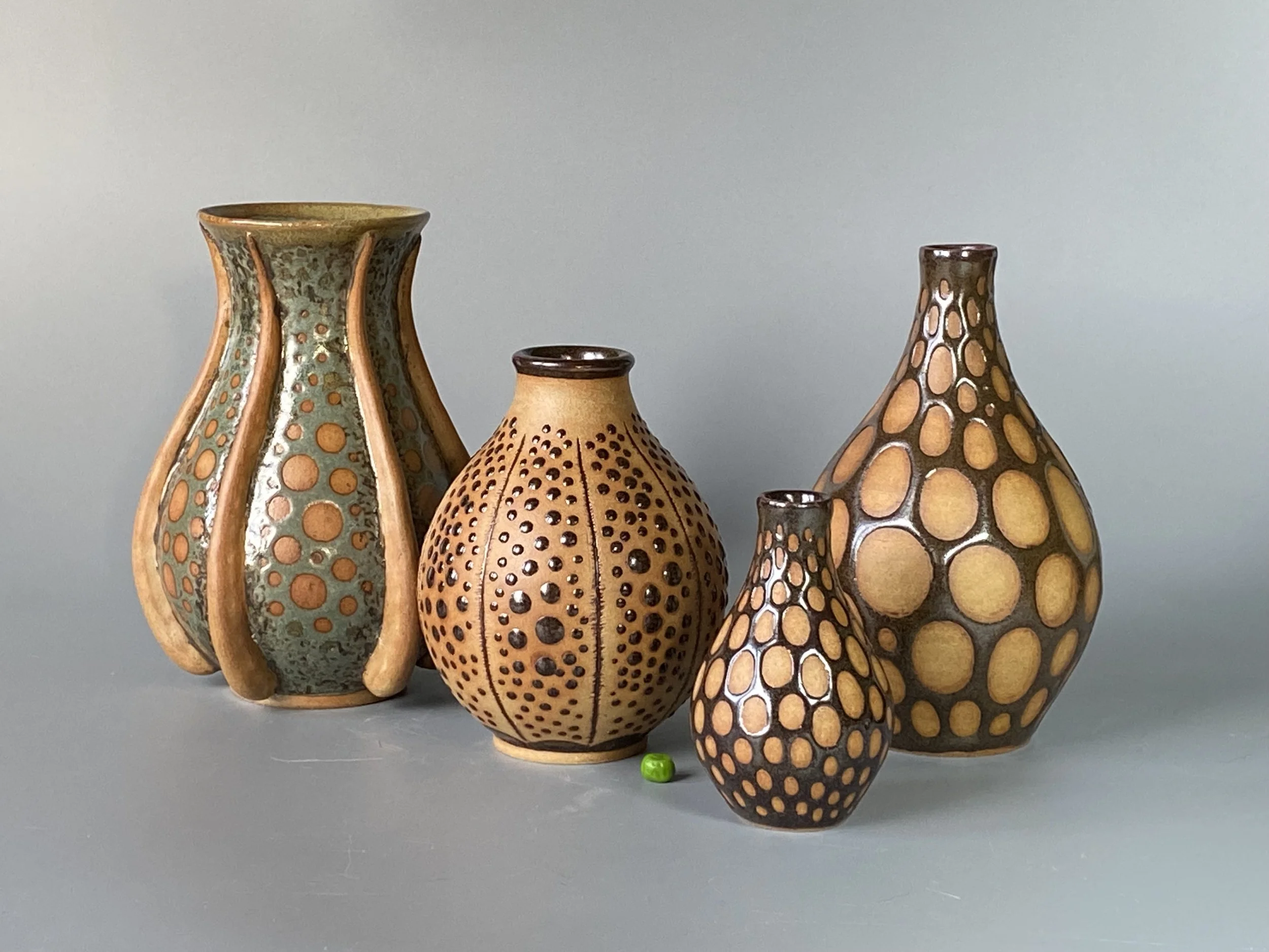 1 Four burnished bottles.jpg