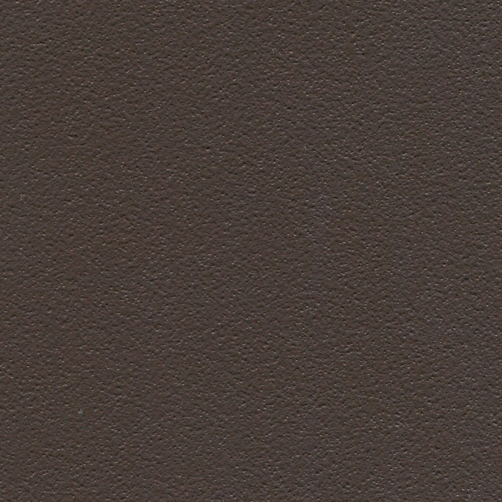 A close-up of a textured brown surface, possibly a wall or furniture material.