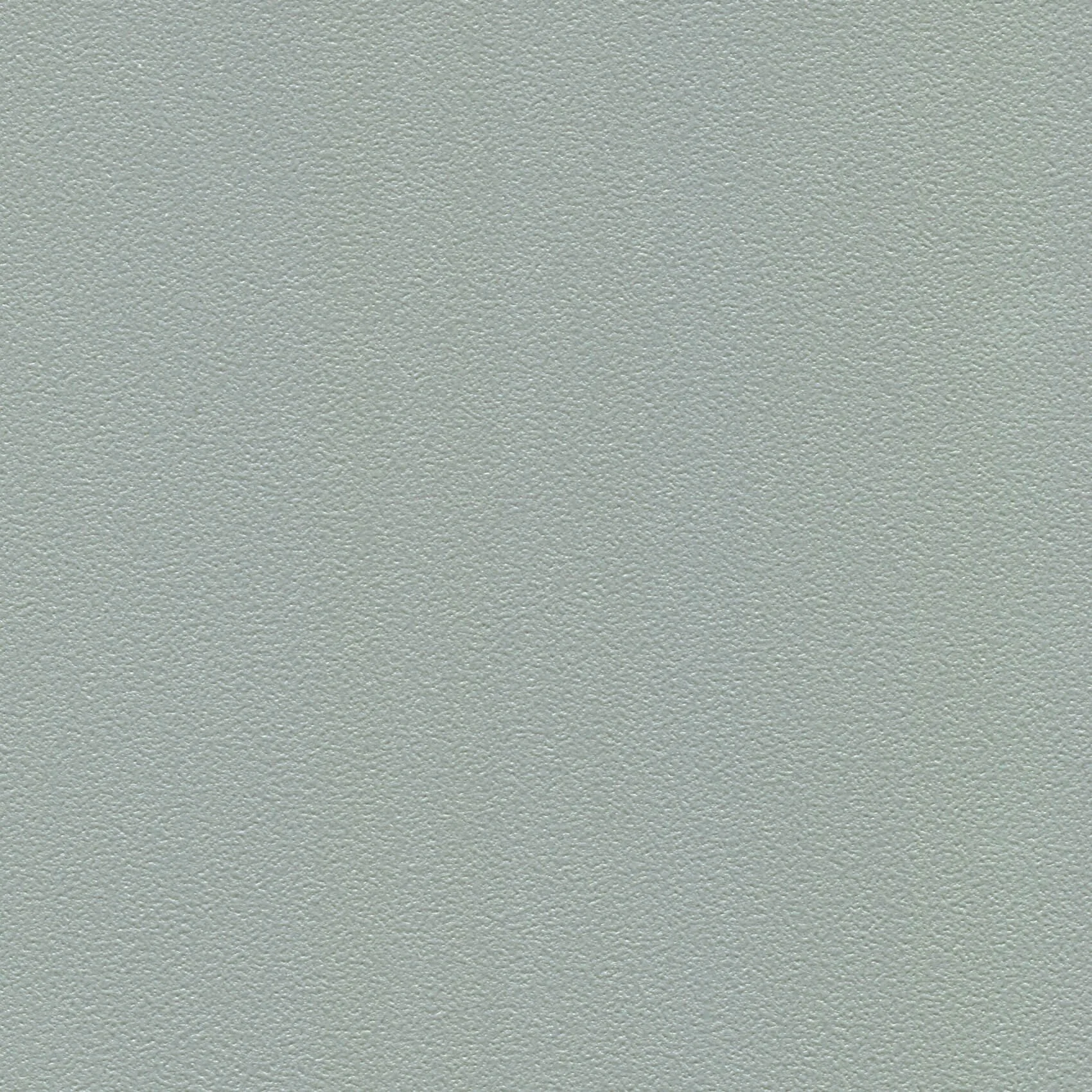 Close-up of a textured beige/gray surface, possibly a wall or ceiling.