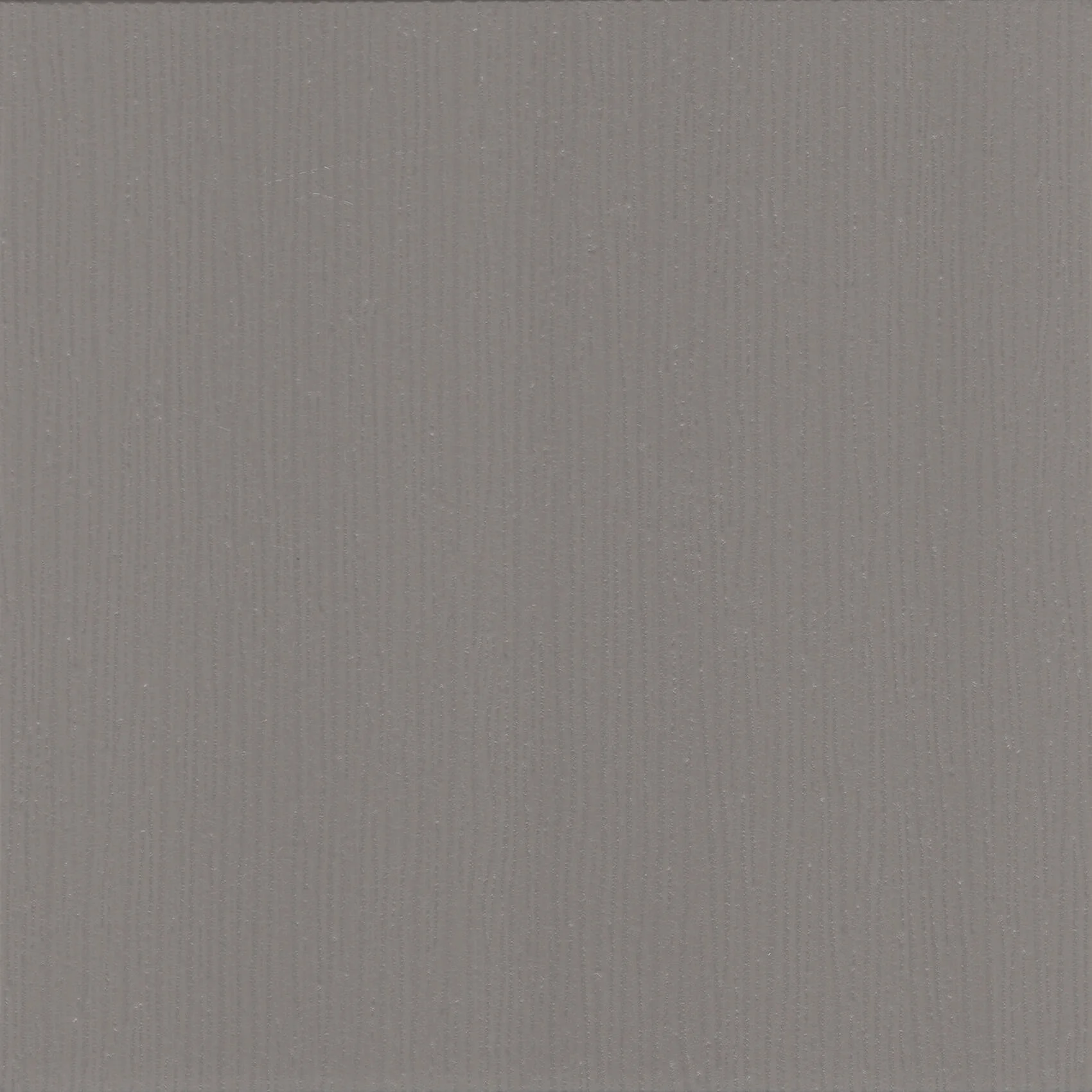 Close-up of a textured gray surface with fine parallel lines.