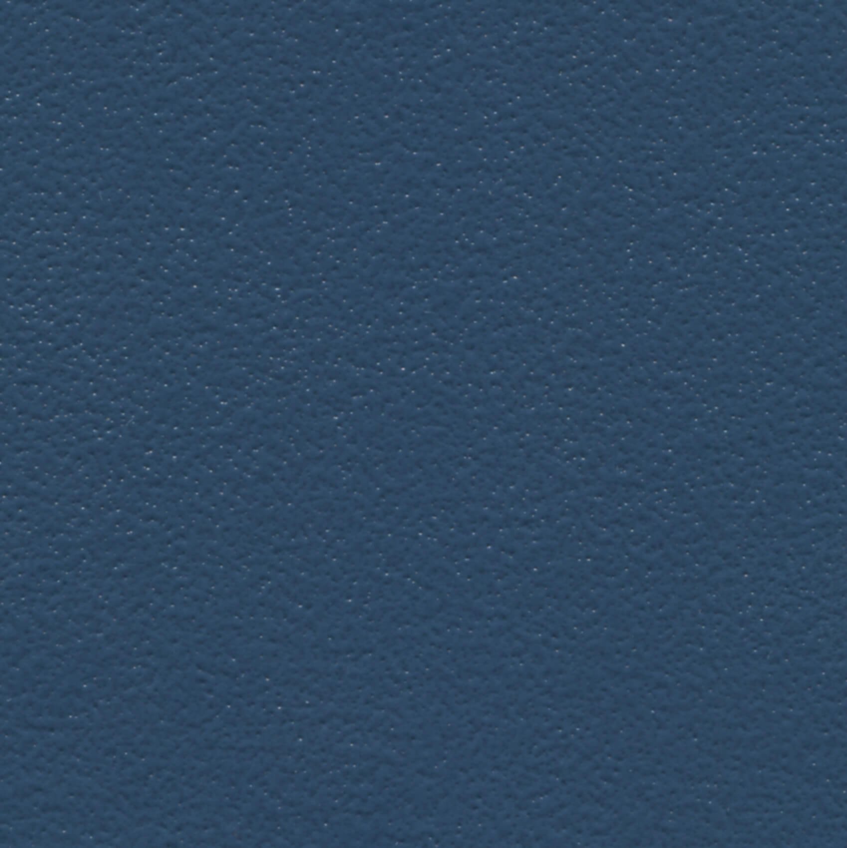 A close-up of a textured, dark blue surface.