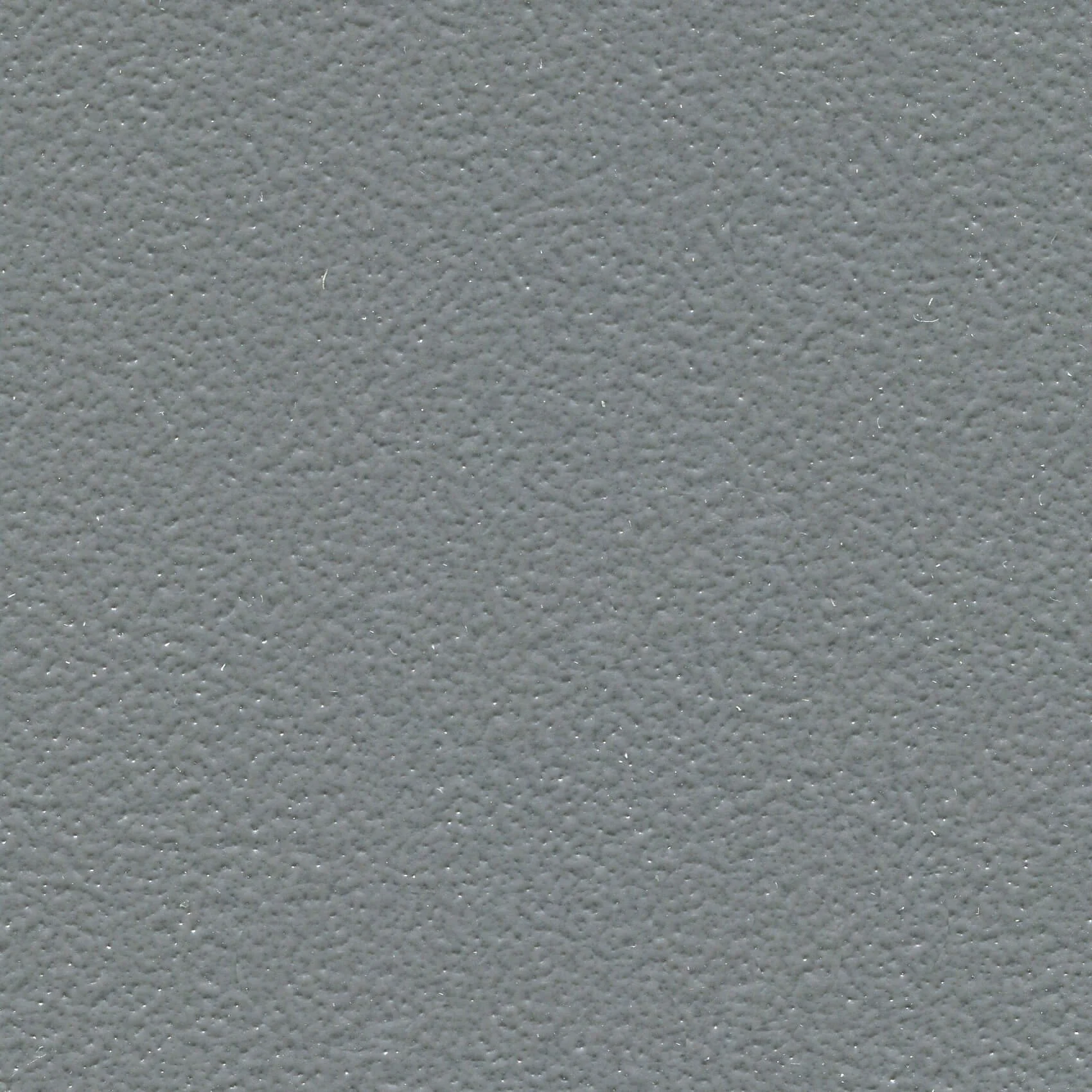 Close-up view of a textured gray surface.