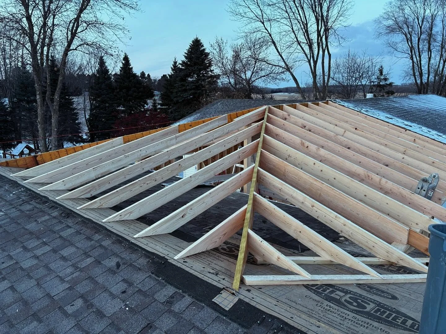 Roof framing of a two-story addition while construction was in progress