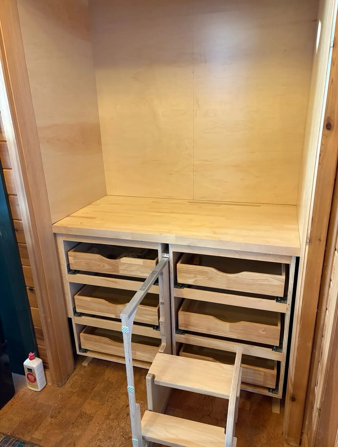 Small step shown beside custom pantry storage in Spicer