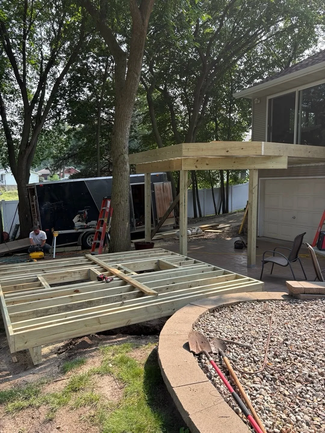 New London deck access opening showing the septic lids beneath the deck